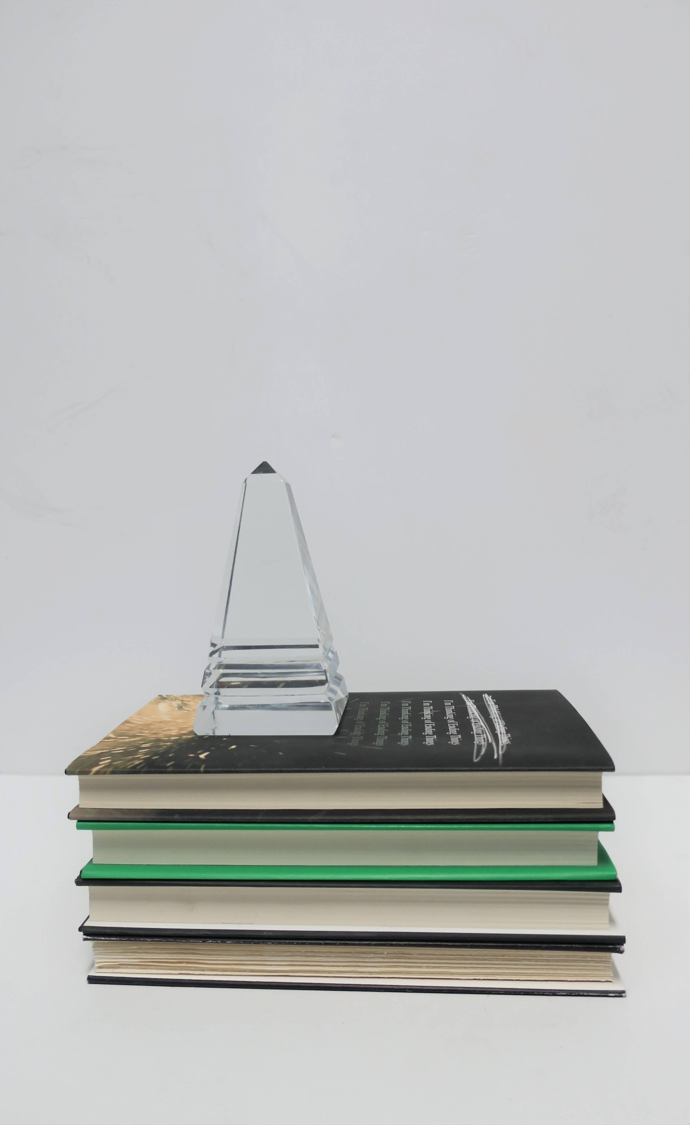A vintage 1970s Modern crystal obelisk with base detail. Beautiful decorative object, desk or office accessory, paperweight, etc. 

Obelisk measures: 2.63 in. square x 5.25 in. H

