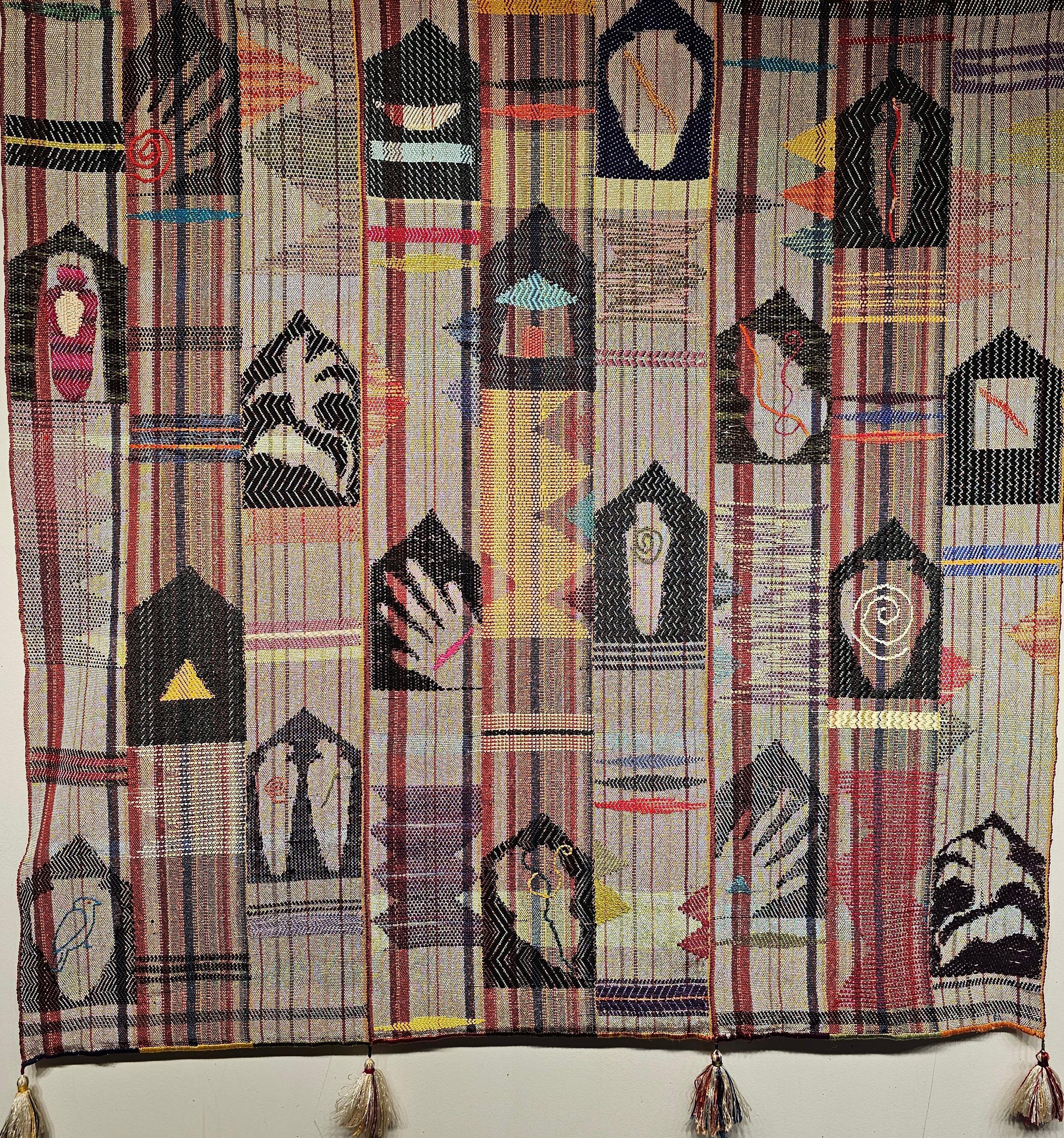 Vintage Handwoven Mid Century Modern Textile Tapestry Wall Art circa the late 1900s. The tapestry has various geometric and figural forms scattered throughout the field. The use of metallic weft and silk in brilliant colors gives a depth to the