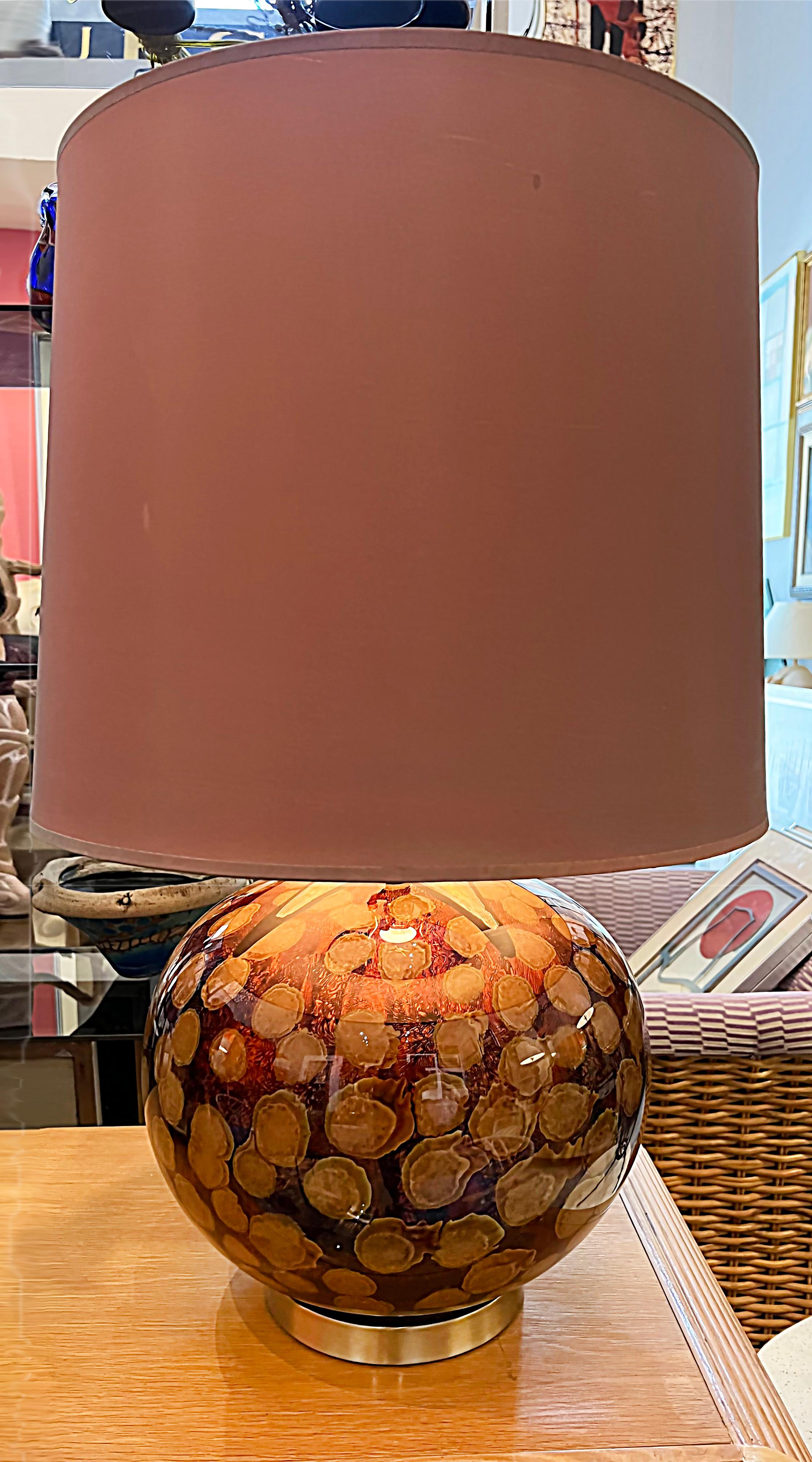 Vintage Modern Eglomise painted glass table lamps

Offered for sale is a pair of vintage modern eglomise glass table lamps complete with their original shades. These reverse painted lamps have great overall design patterns with painted abstract