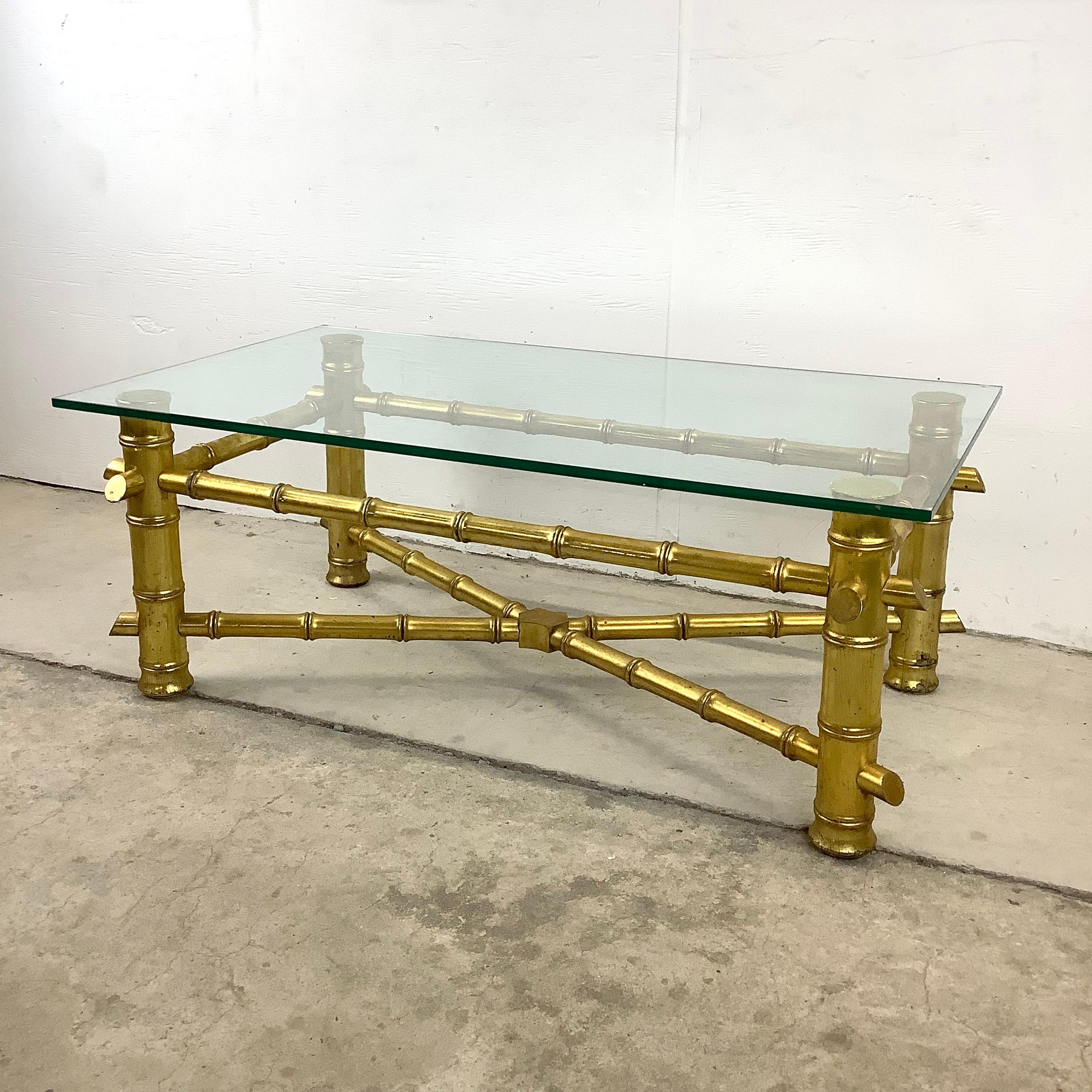 This vintage modern faux bamboo coffee table features a sturdy metal frame with thick glass top, while the unique decorative finish adds boho chic centerpiece to any seating arrangement. Petite size makes this a great choice in adding maximum style