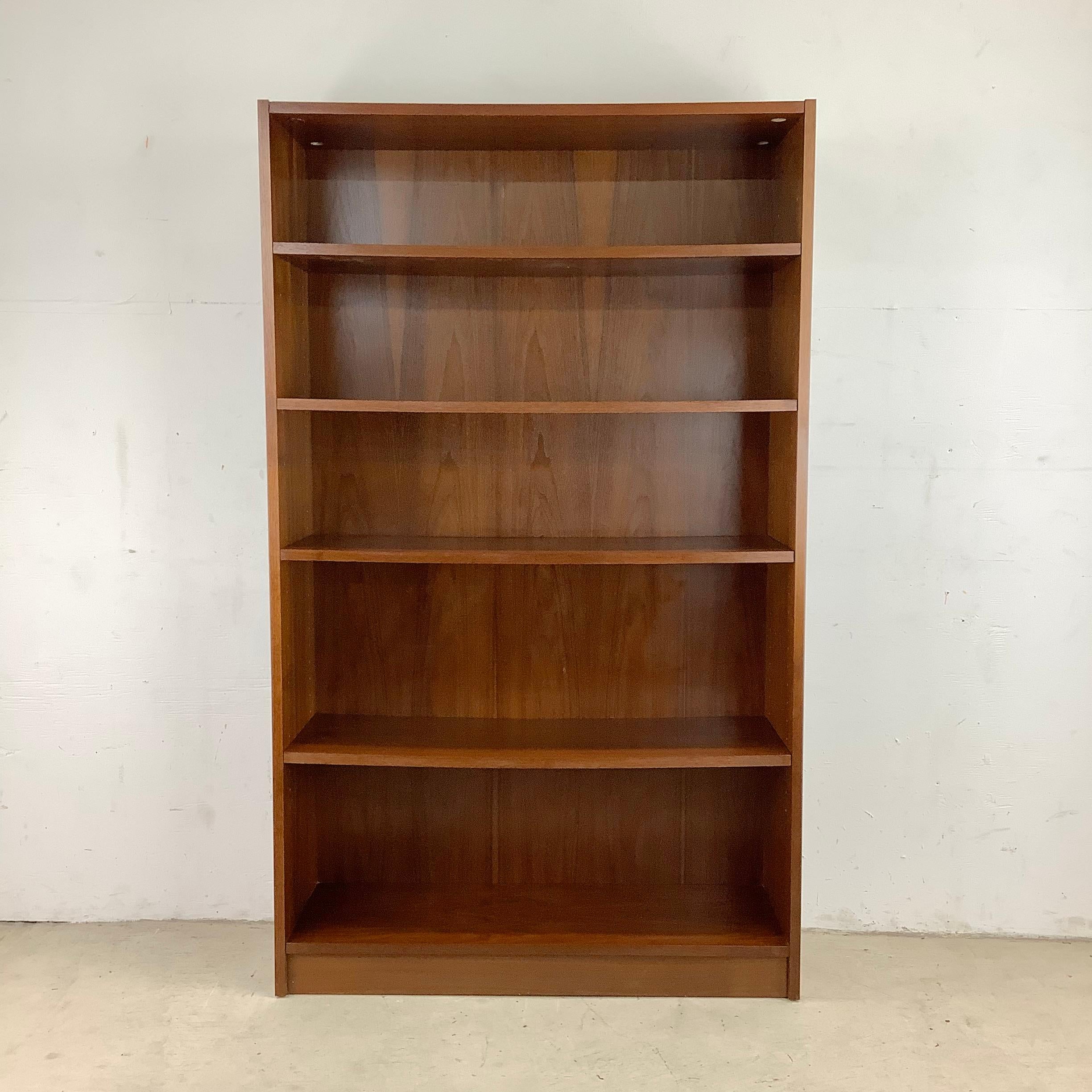This Vintage Modern Bookcase with Adjustable Shelving combines vintage charm with practical storage solutions. Crafted with careful attention to detail, this bookcase showcases the timeless beauty of natural wood grain. Its rich tones and elegant