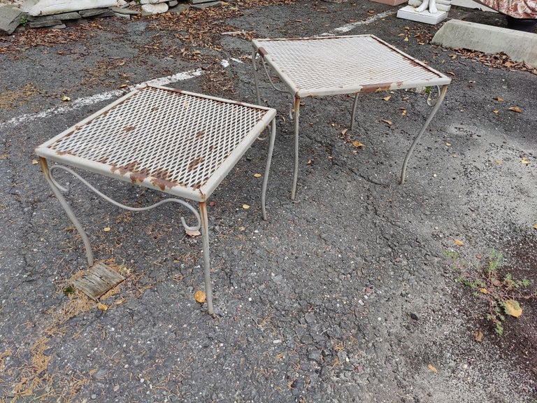 Sturdy pair of Mid-Century Modern stacking end tables. These wrought iron side tables work perfectly on a patio, pool deck, or balcony. 

Please confirm item location NY or NJ with dealer.