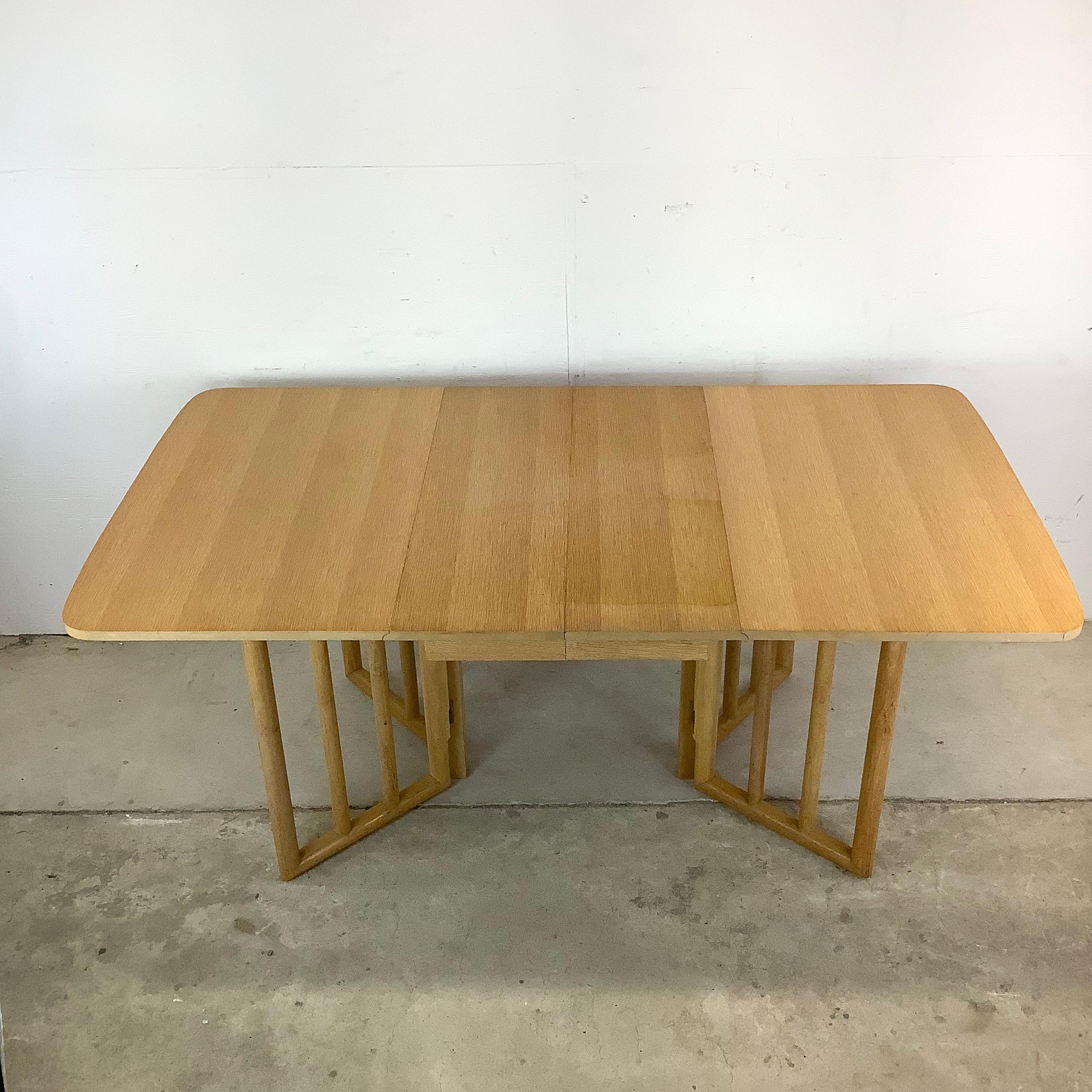 This gate-leg dining table beautifully channels the mid-century vision of Robsjohn-Gibbings — a blend of graceful form and ingenious utility. Made of birch, it showcases a golden tone that feels warm and inviting while maintaining a modern