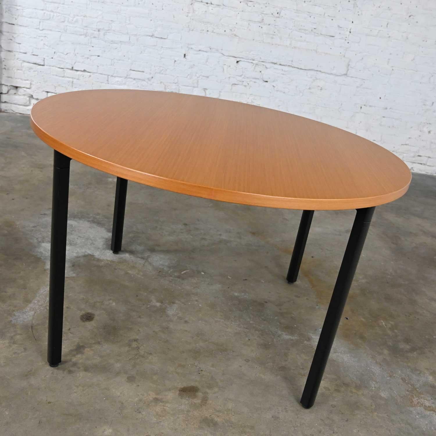 Chic Herman Miller Everywhere vintage modern table with natural oak wood veneer and rounded square black metal legs by Dan Grabowski. Beautiful condition, keeping in mind that this is vintage and not new so will have signs of use and wear. There are