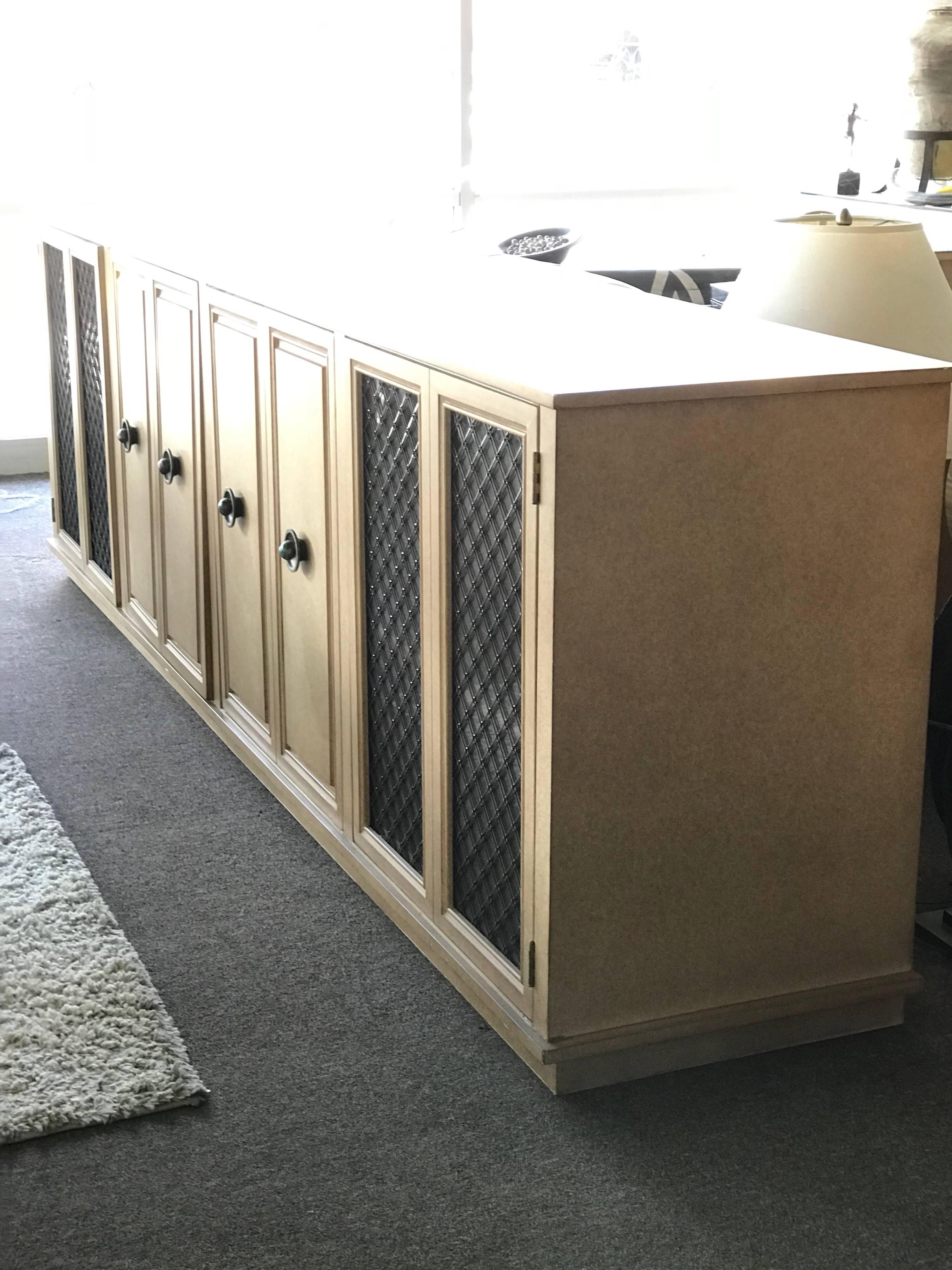 This amazing 9 ft long credenza was from a vintage chic and glamorous Palm Springs Estate that was decorated by a Beverly Hills designer. It is modern but also very glamorous a la Hollywood Regency style of William 