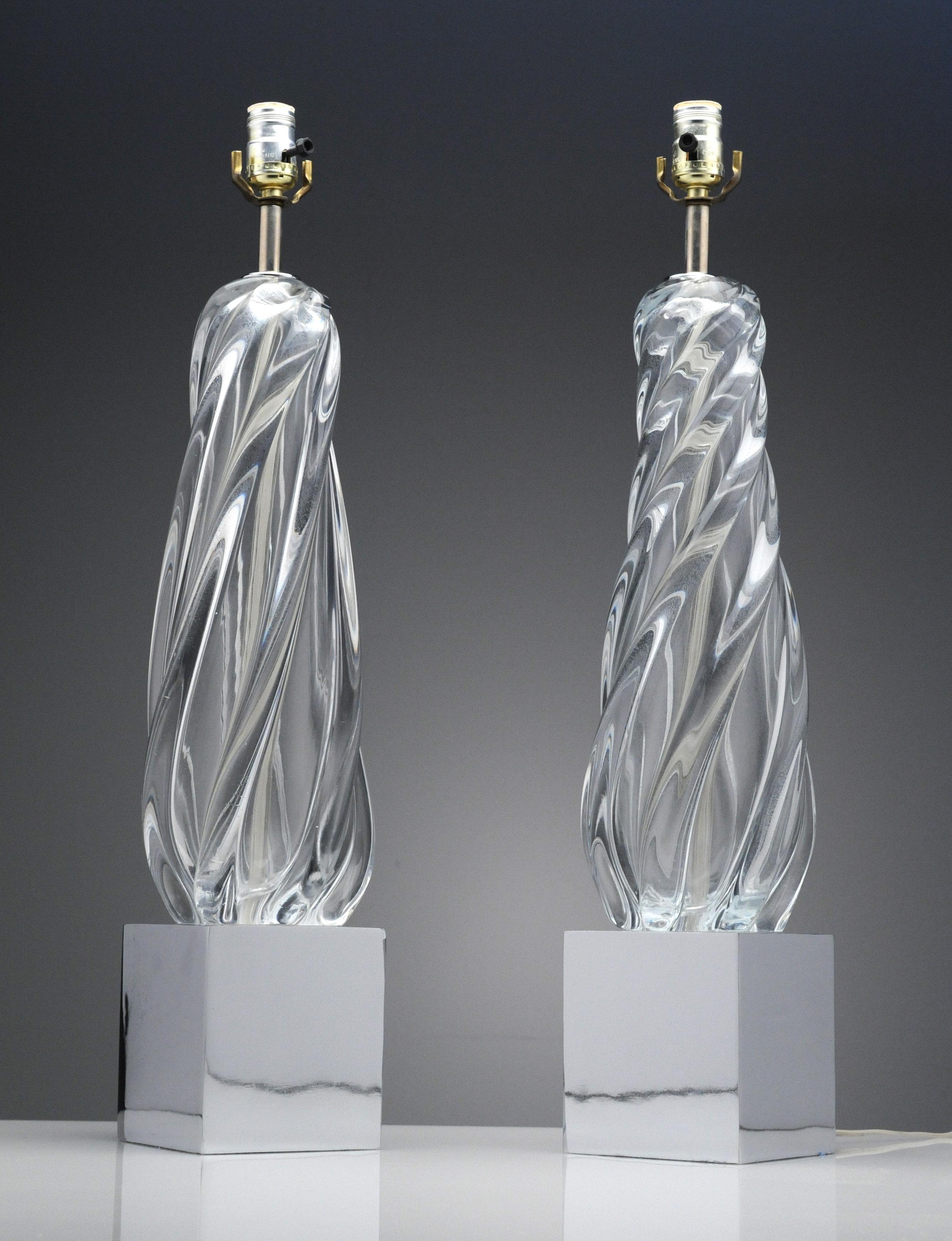 Wonderful pair of vintage clear glass and chrome table lamps. The lamps date back to the 1970s. Lamps measure 27