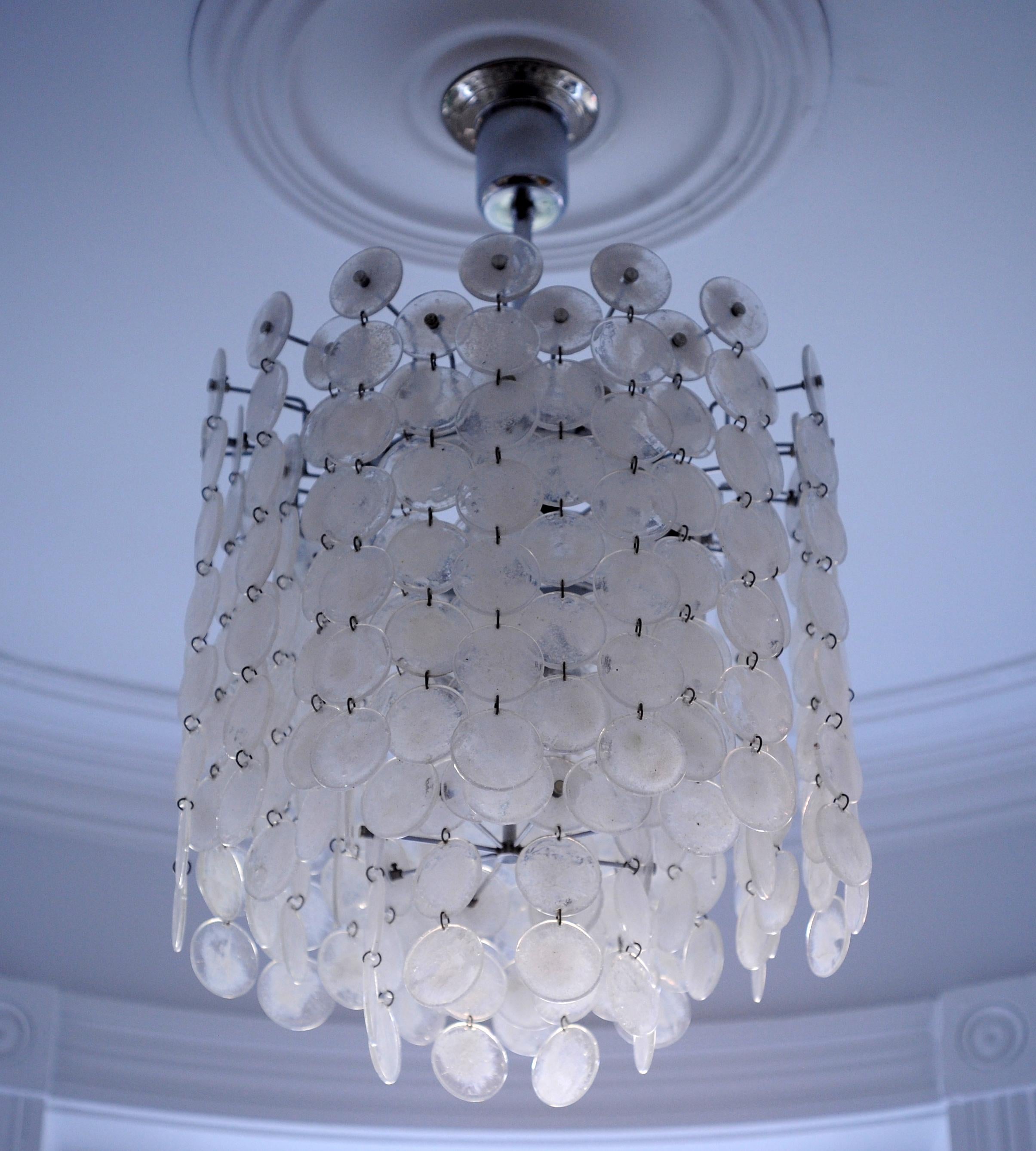 Beautiful vintage glass disc chandelier by Vistosi of Murano Italy. This elegant chandelier has two levels of lighting with eight bulbs at the top and six on the bottom. Chandelier is well made and in very good condition.