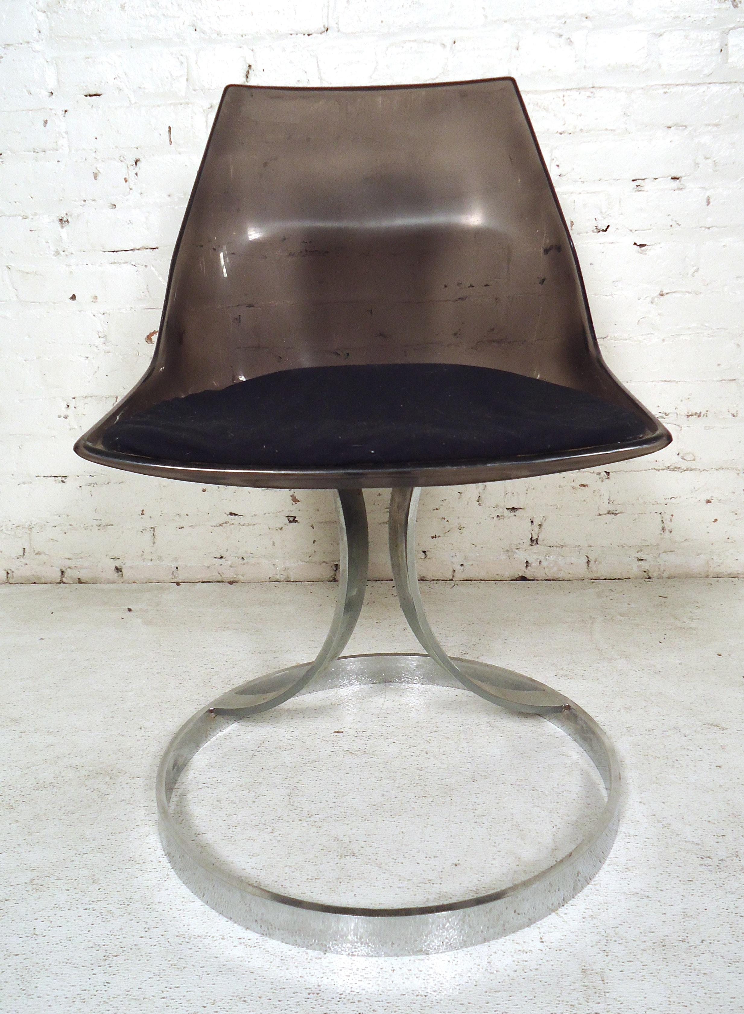 Italian Mid-Century Modern style Lucite chair featuring chrome legs and upholstered cushion.

(Please confirm item location - NY or NJ - with dealer).
 