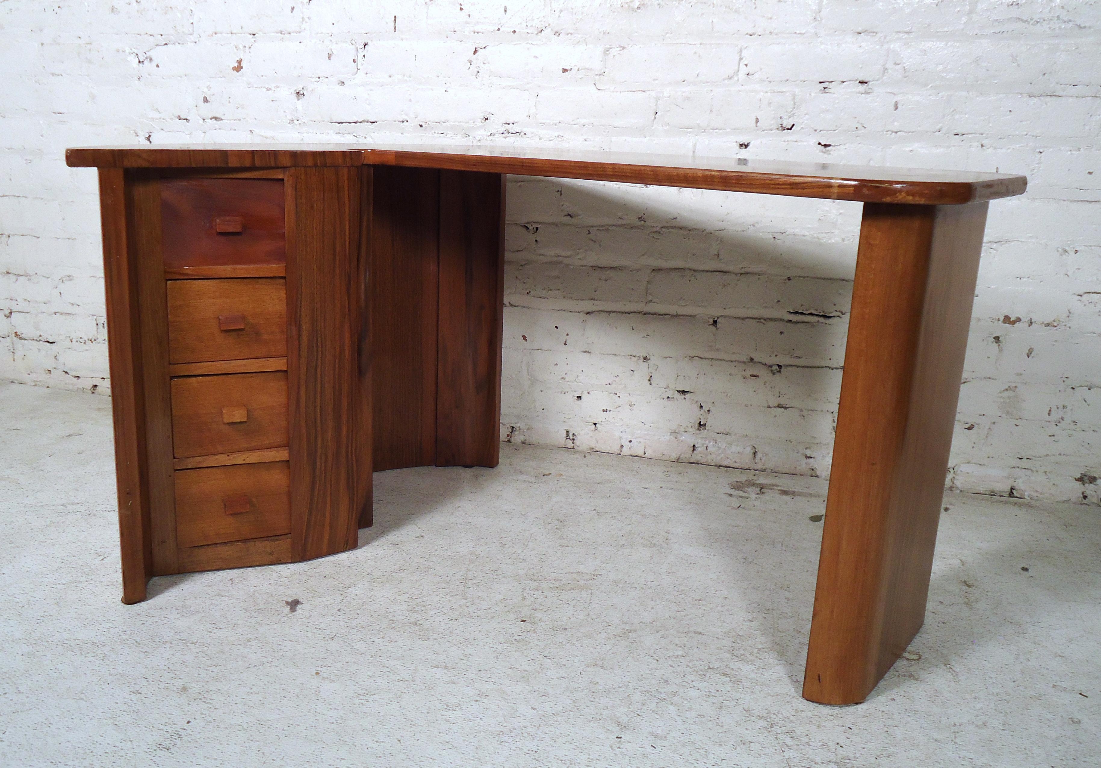 Small Mid-Century Modern boomerang style desk for kids features four drawers with sculpted pulls.

(Please confirm item location-NY or NJ, with dealer).