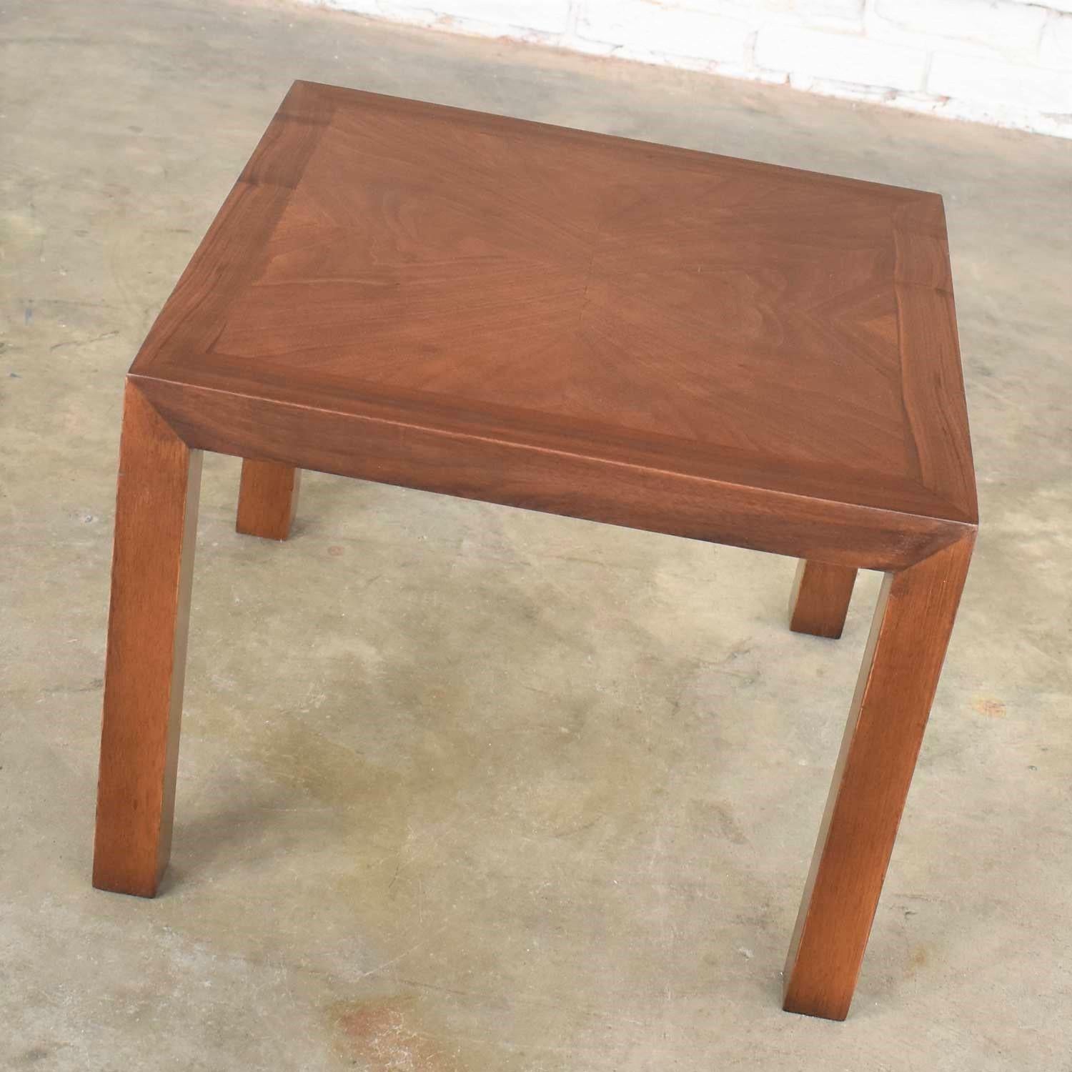 Handsome vintage modern square solid walnut Parsons’ side table with walnut inlay created by Lane Alta Vista in 1970. It is in wonderful ready to use condition. The top has been refinished as it had several cigarette burns. There may still be small