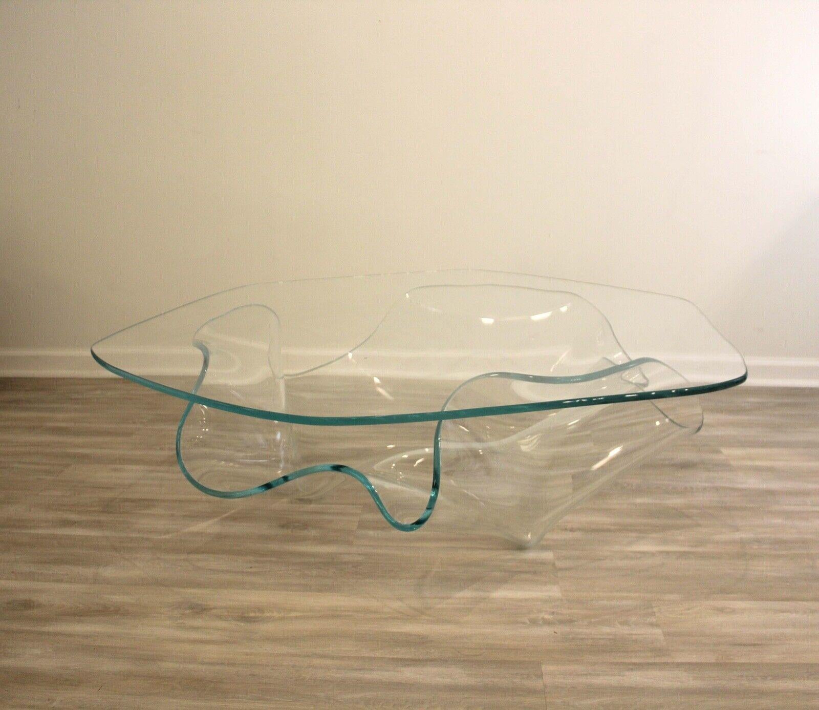 For your consideration is this showstopping handkerchief glass Laurel Fyfe coffee cocktail table. Dimensions: 52W x 49D x 15.5H.
 