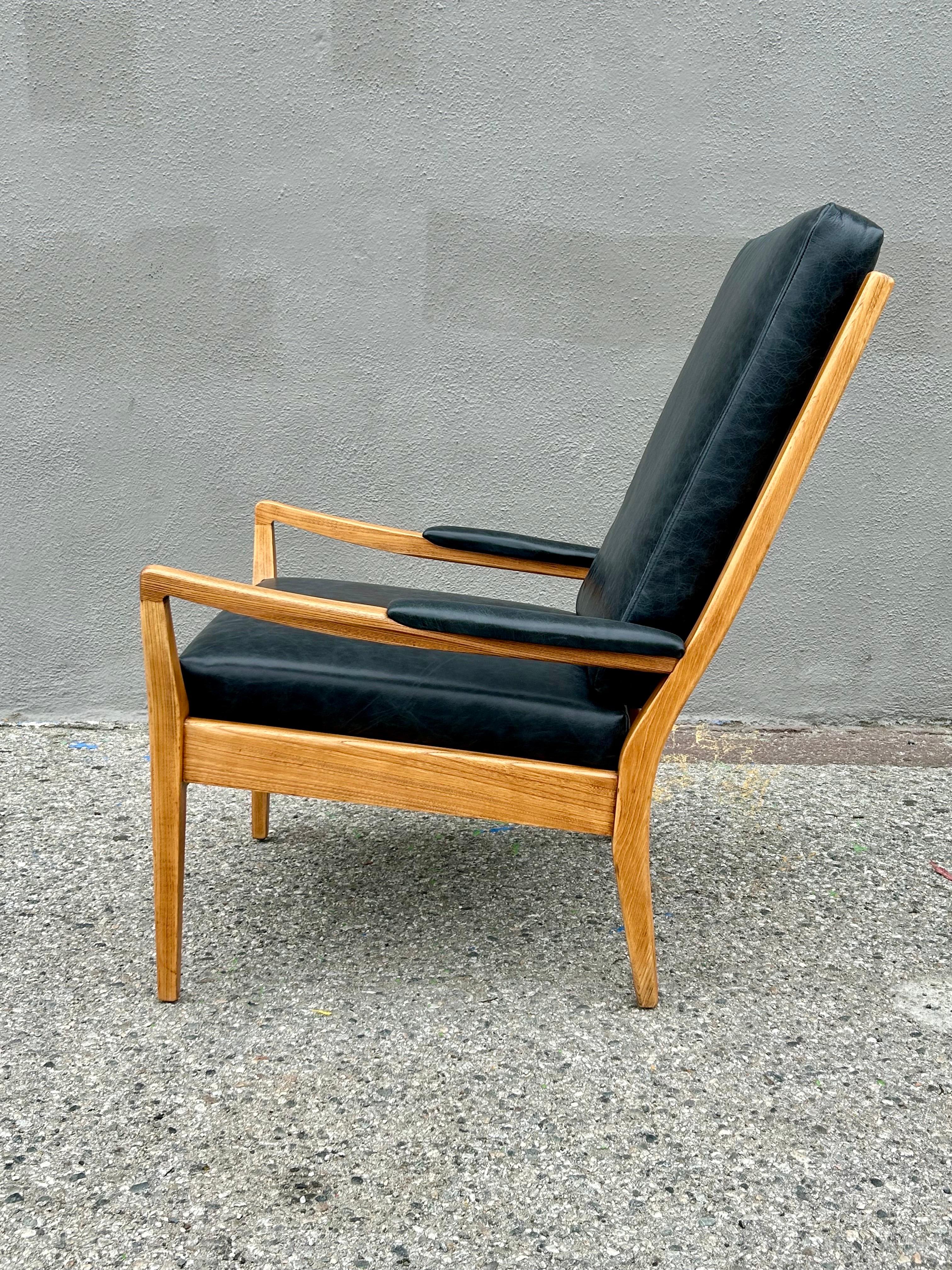 Classic mid century modern design.
Limited production.
Teak wood frame with ladder high backrest.
New leather upholstered cushions.
Refinished natural.
Solid, sturdy and stout.
Great for any interior... 
