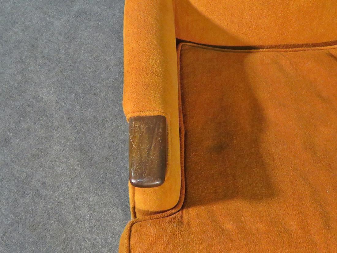 Yellow Mid-Century Modern high back lounge chair featuring yellow upholstery with walnut accents.

(Please confirm item location - NY or NJ - with dealer).