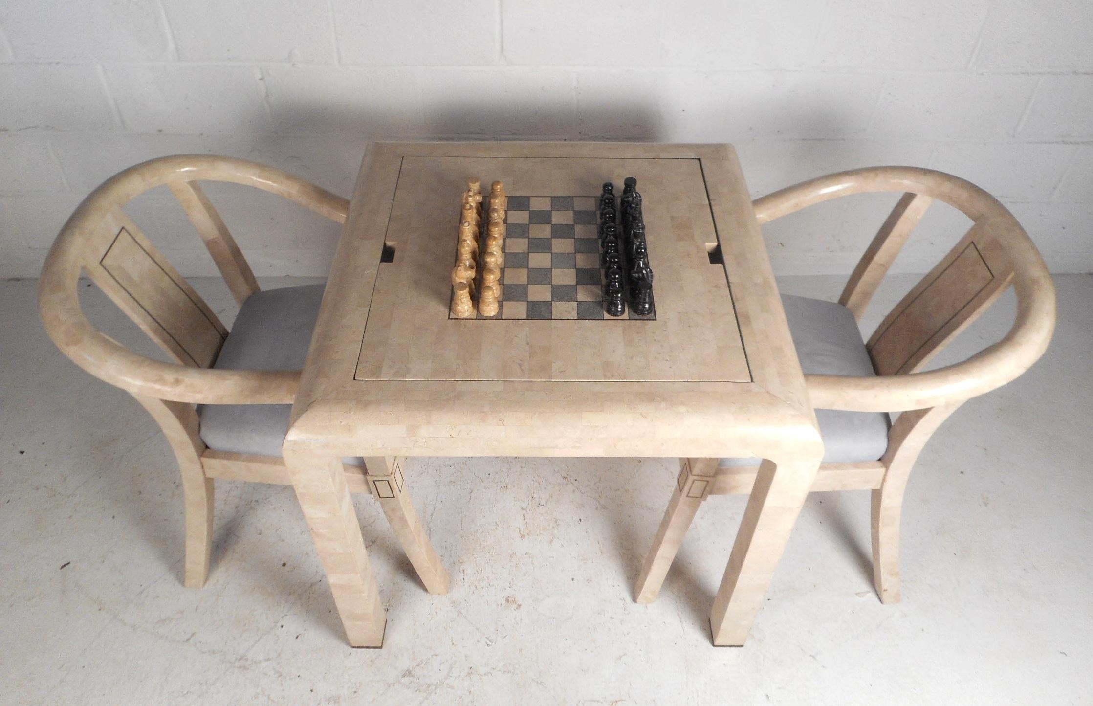 This stunning Mid-Century Modern game table features a reversible top with a backgammon board underneath and lovely brass inlays throughout. A versatile design with one side being tessellated stone and the other functions as a chessboard. This