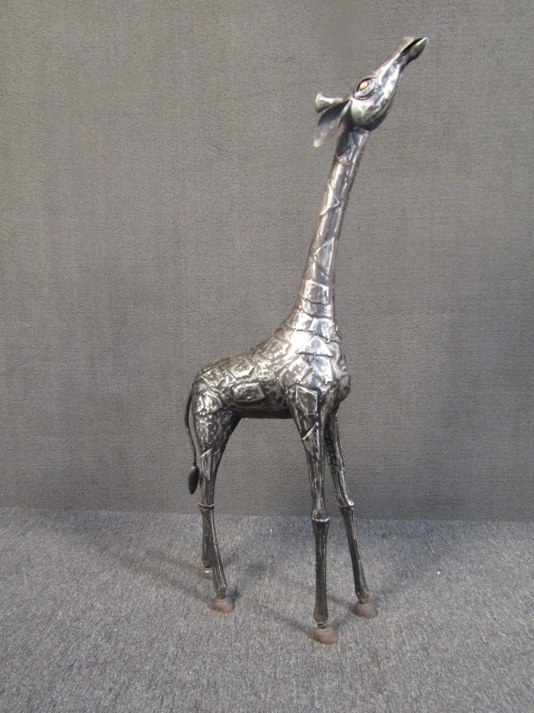 Unique and eye-catching giraffe sculpture cast in patchwork metal with intricate detailing. A stand-out piece for any outdoor or indoor setting. 

Please confirm item location with seller (NY/NJ).