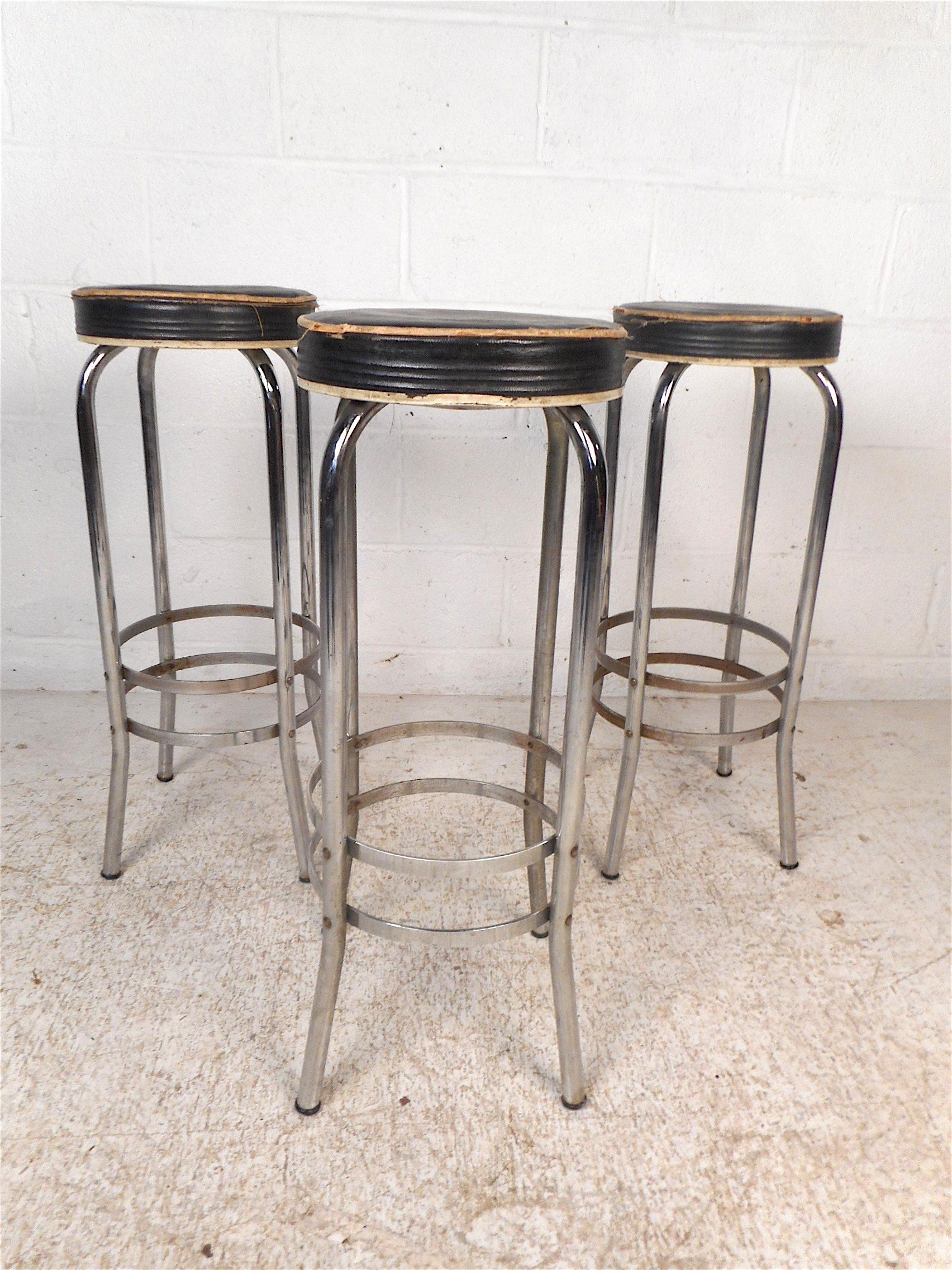 Interesting set of 3 vintage modern stools. Sleek and sturdy metal frame with footrests. This set is sure to be a great addition to any modern interior. Please confirm item location with dealer (NJ or NY).