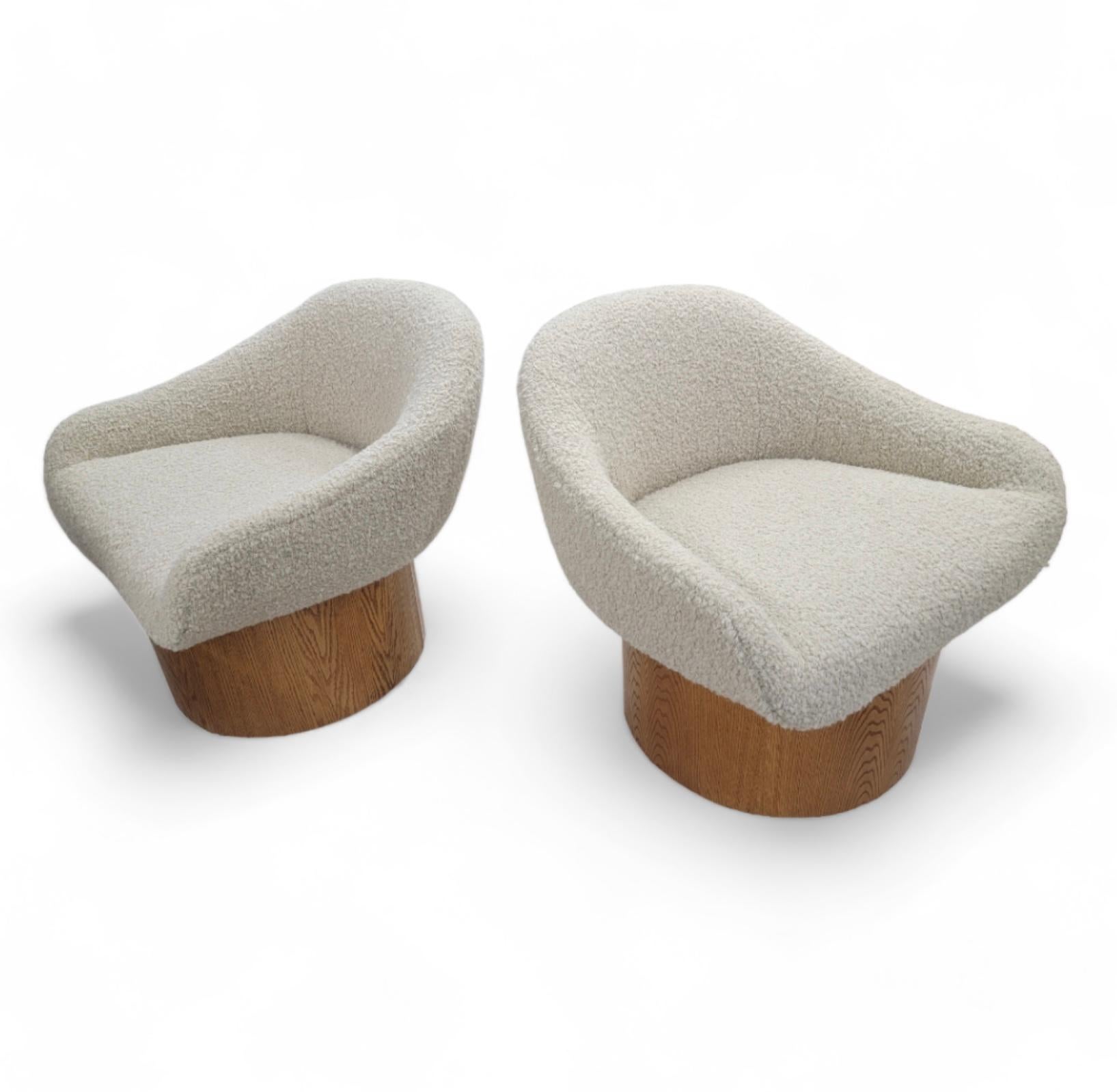 Vintage Modern Milo Baughman Style High Barrel Base Curved Arm Lounges Newly Upholstered In Sand Boucle - Pair

The Vintage Modern Set of Milo Baughman Styled High Barrel Base Curved Arm Lounges Newly Upholstered In Sand Boucle is a stunning blend