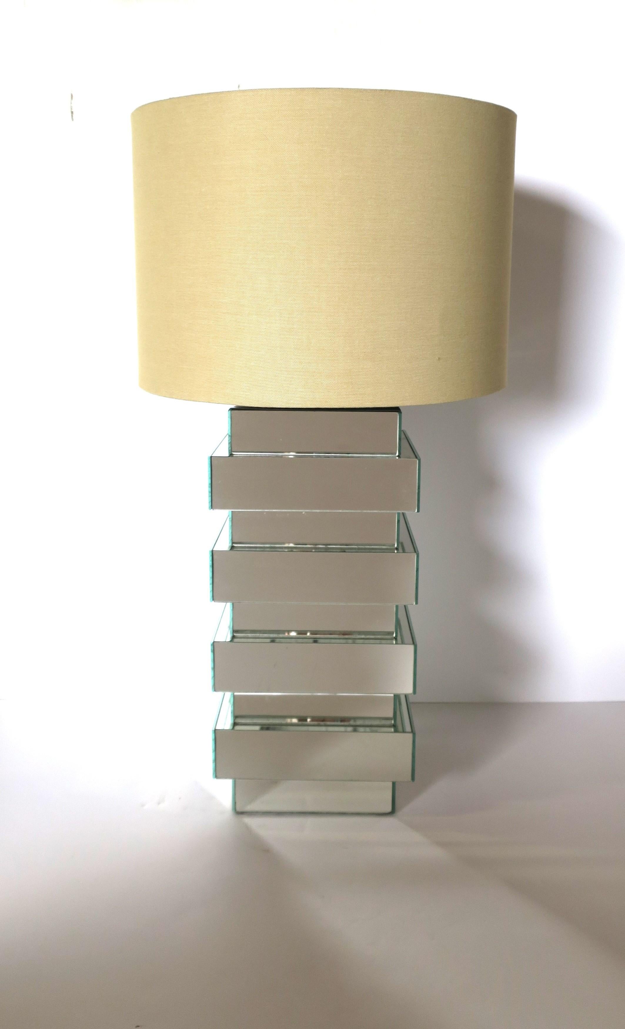 A substantial mirrored table lamp, in the Modern style, circa 1970s modern period. A beautiful well made all mirror table lamp, with chrome plate at top (just under socket, please see image #9.) In fine working order. 

Over all dimensions: 8.75