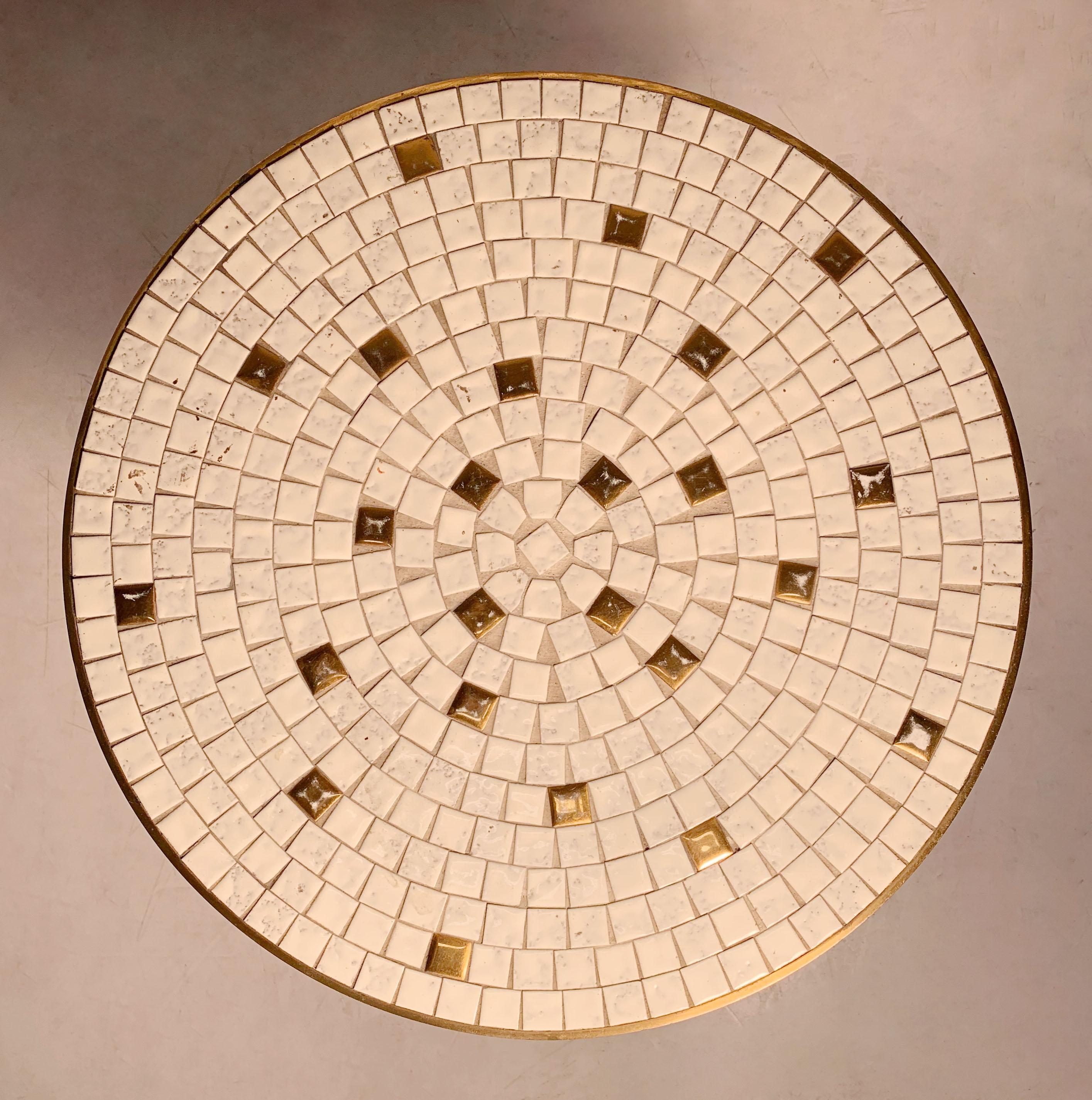 Vintage modern mosaic tile occasional table. Solid brass circular frame. Very good craftsmanship. More picture available. Possibly Italian. Uncertain to origin. Manner of Gordon Martz Tile Tops.

I have a second one that is semi matching. very
