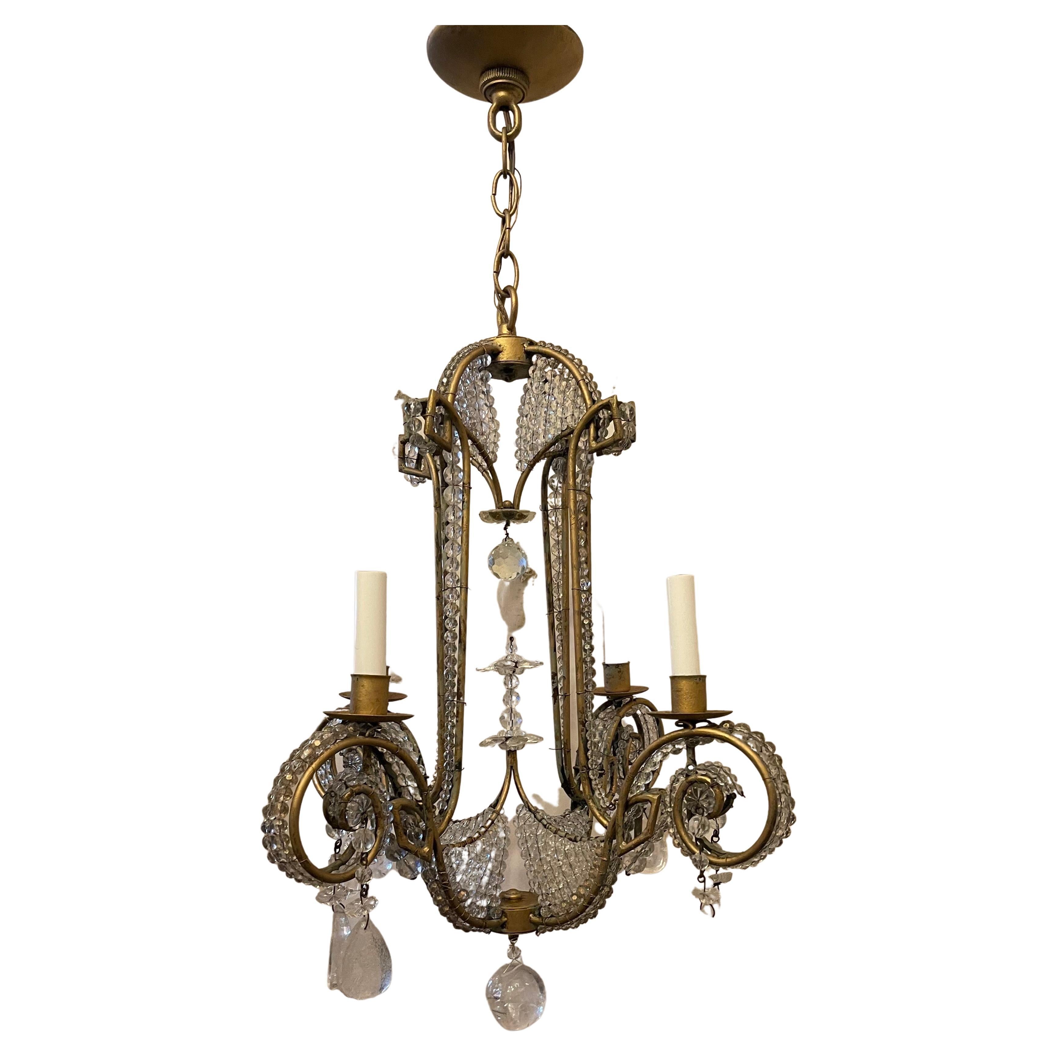 A wonderful Vintage Modern Niermann Weeks gold gilt four-light beaded with rock crystal drops chandelier in the manner of Maison Baguès.