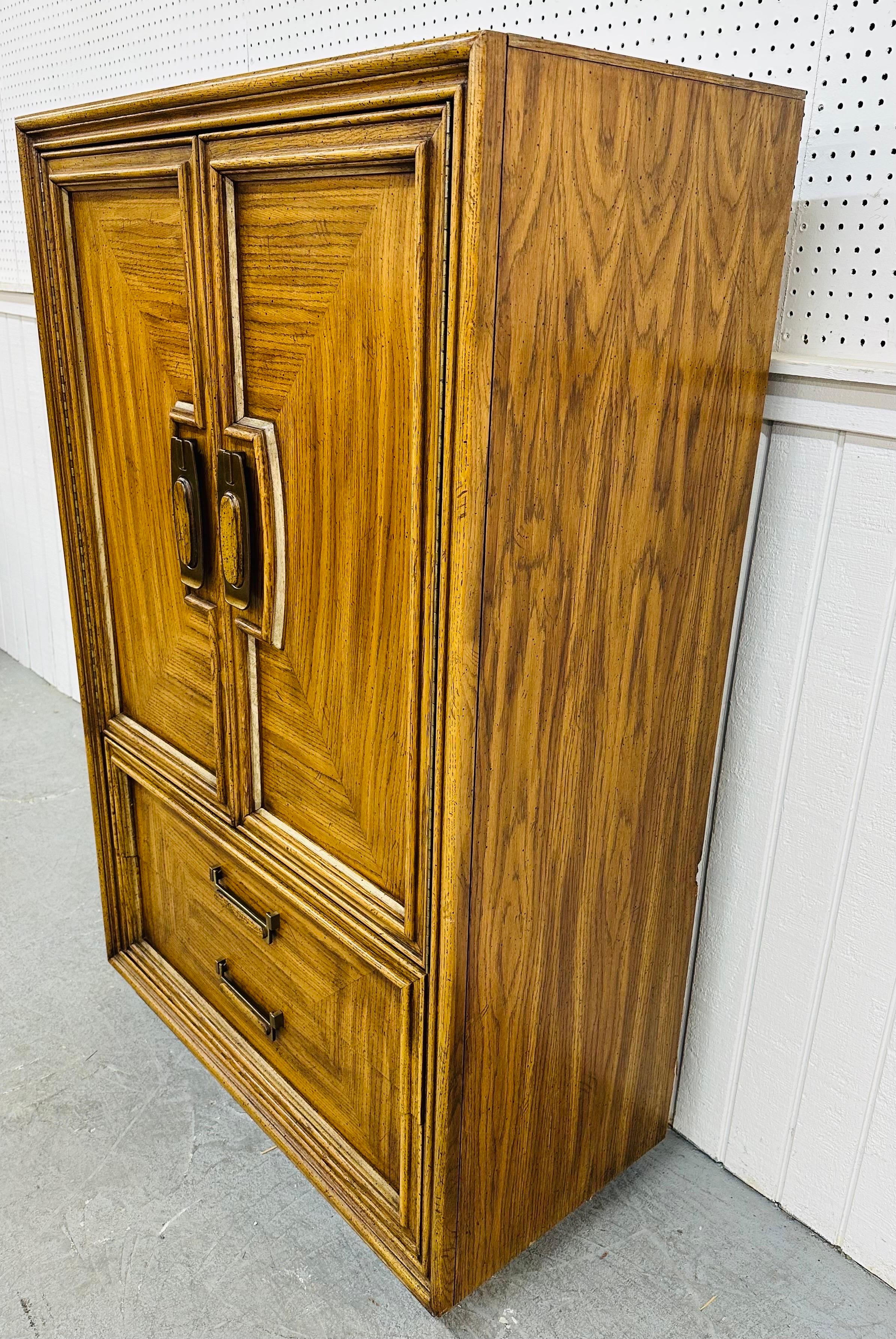 This listing is for a vintage Modern Oak Armoire. Featuring a straight line design, two large doors that open up to hidden drawers with storage space, two larger drawers at the bottom, original hardware, and a beautiful oak finish. This is an