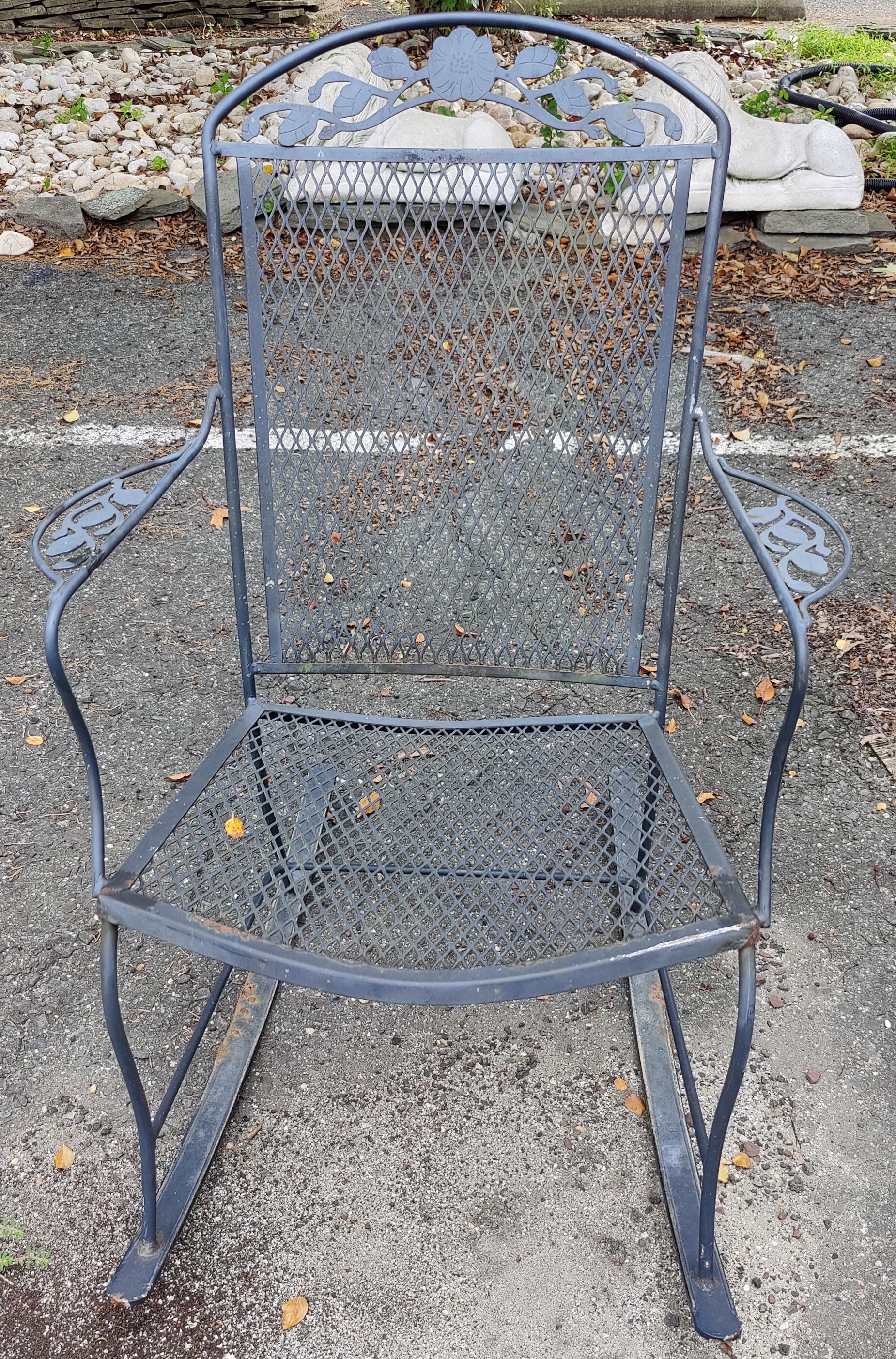 Mid-Century Modern iron patio rocking chair. This gorgeous rocker features elegant scrollwork and flower designs. Perfect for a deck, patio, or covered porch.

Please confirm item location (NY or NJ).
