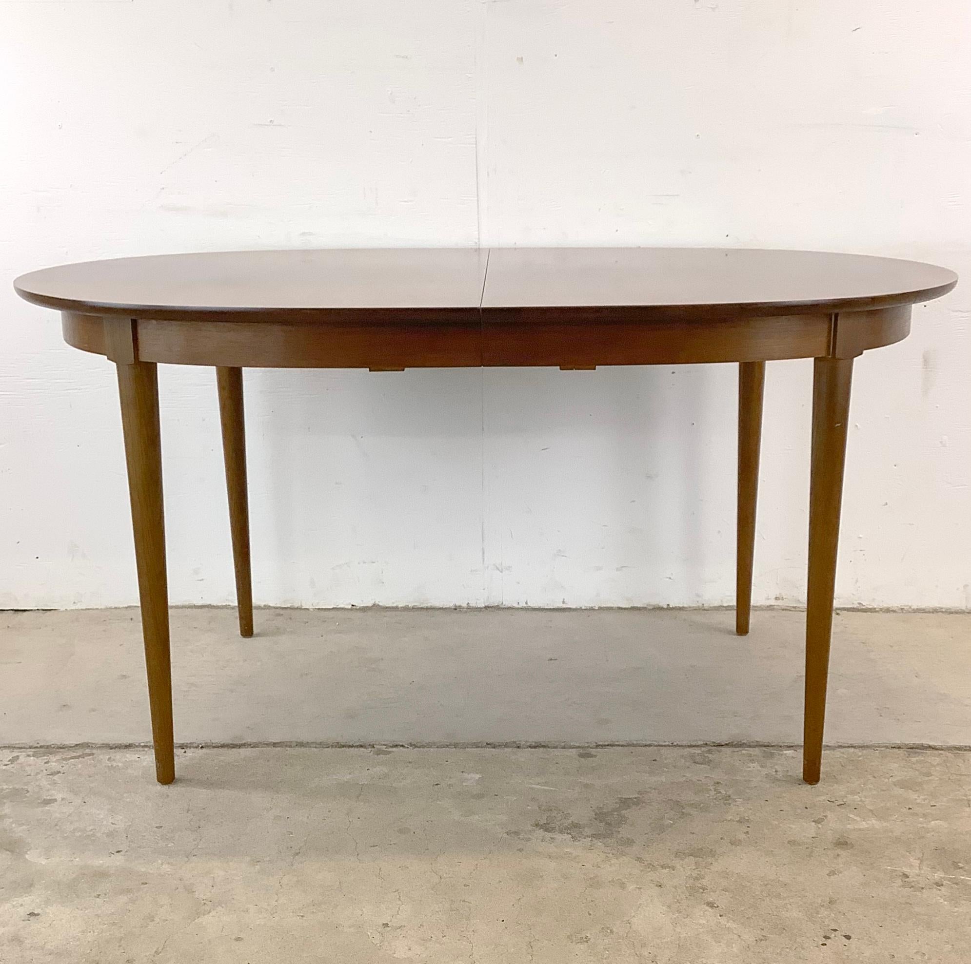 Introducing this unique Vintage R-Way Dining Table with removable leaves– a Danish delight that's sure to elevate your dining experience to new heights. This table exudes mid-century charm with its walnut inlaid rounded oval design, making it a