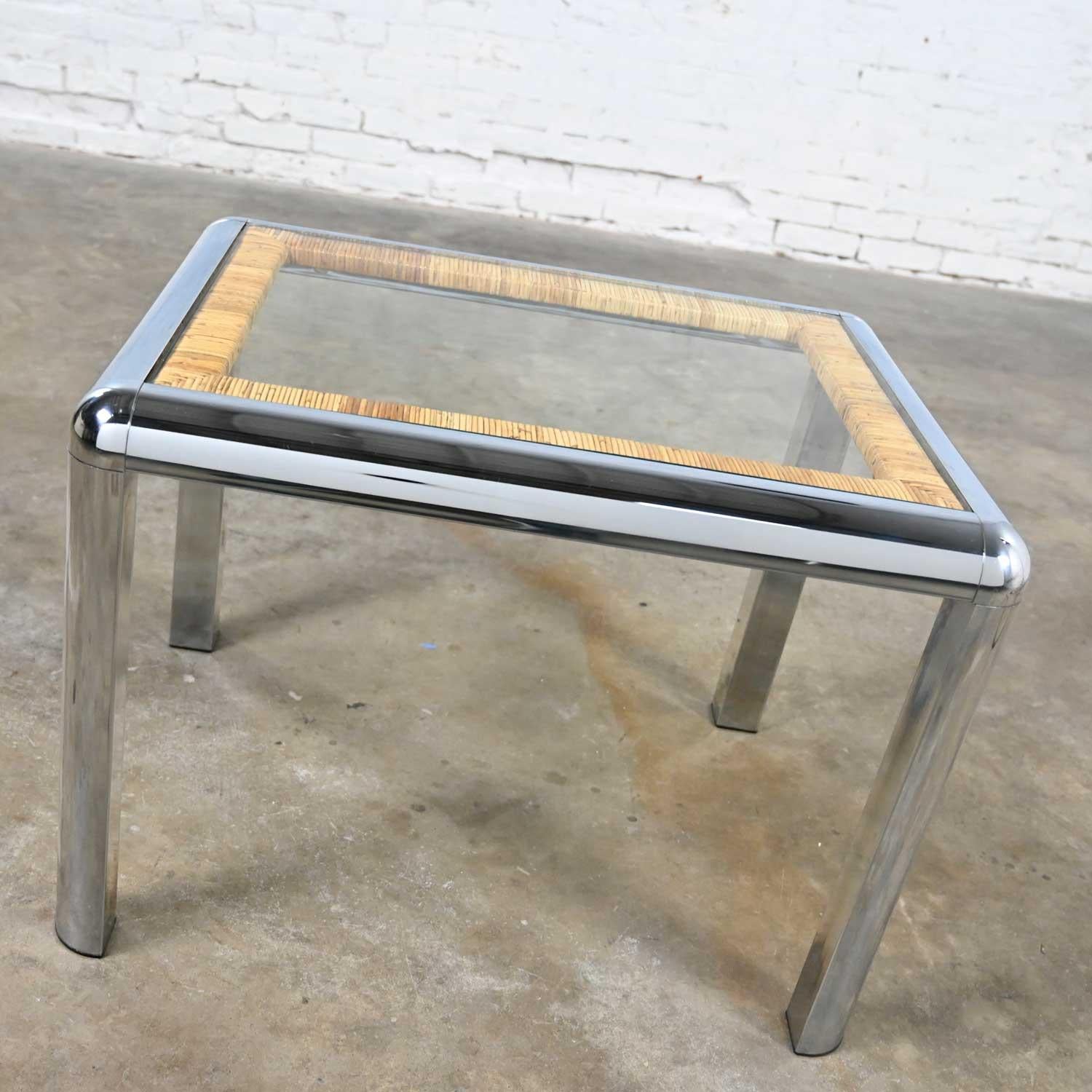 Stunning vintage modern rectangular chrome, glass, and wrapped rattan side table attributed to DIA (Design Institute of America). Beautiful condition, keeping in mind that this is vintage and not new so will have signs of use and wear. Please see