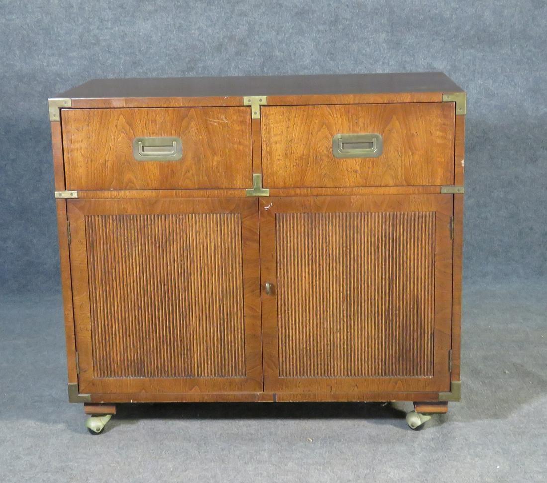 Mid-century modern rolling campaign chest by Henredon featuring two drawers and a spacious lower cabinet.

Please confirm item location (NY or NJ) with dealer.