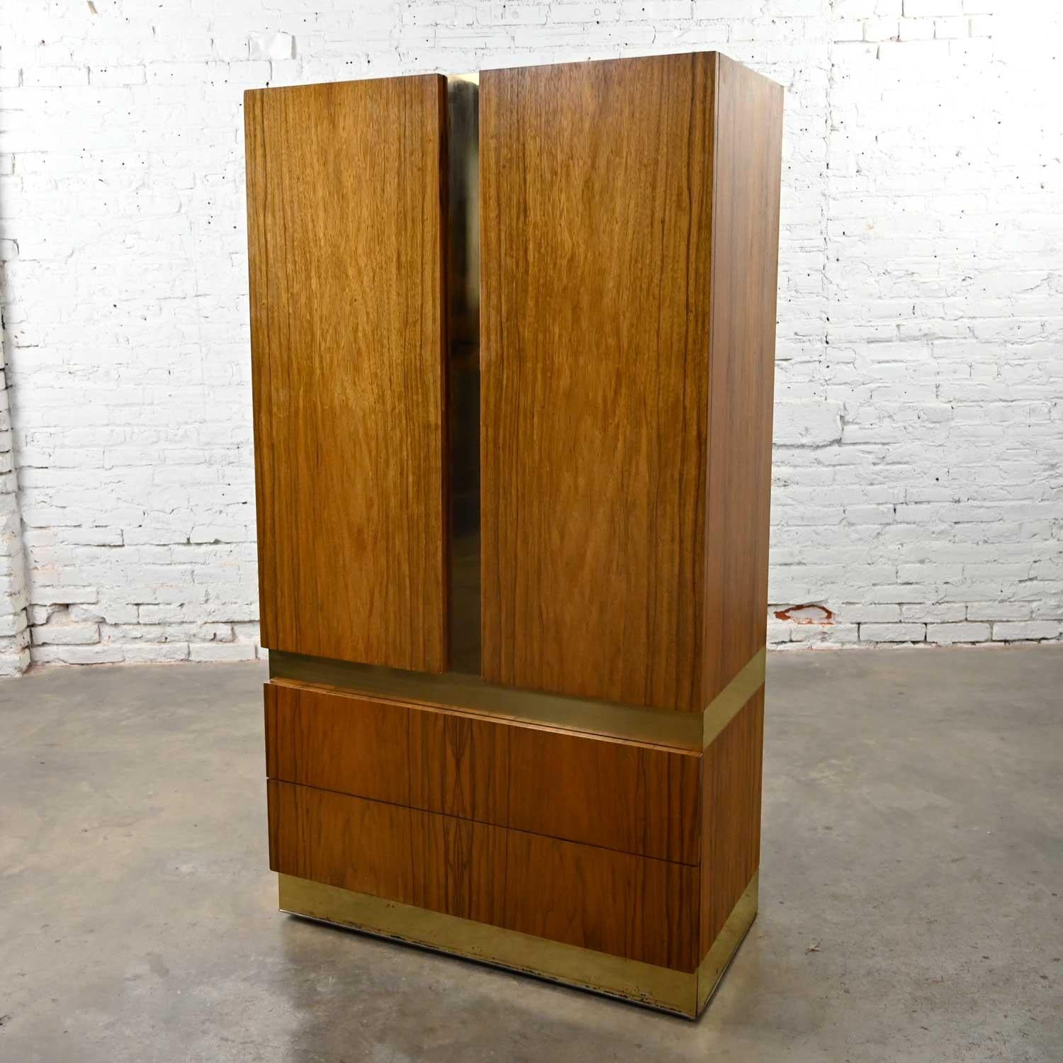 Phenomenal vintage modern rosewood & brass plate wardrobe or chifforobe by Milo Baughman for Thayer Coggin. Comprised of gorgeous rosewood veneer and brass plated steel bands. Beautiful condition, keeping in mind that this is vintage and not new so