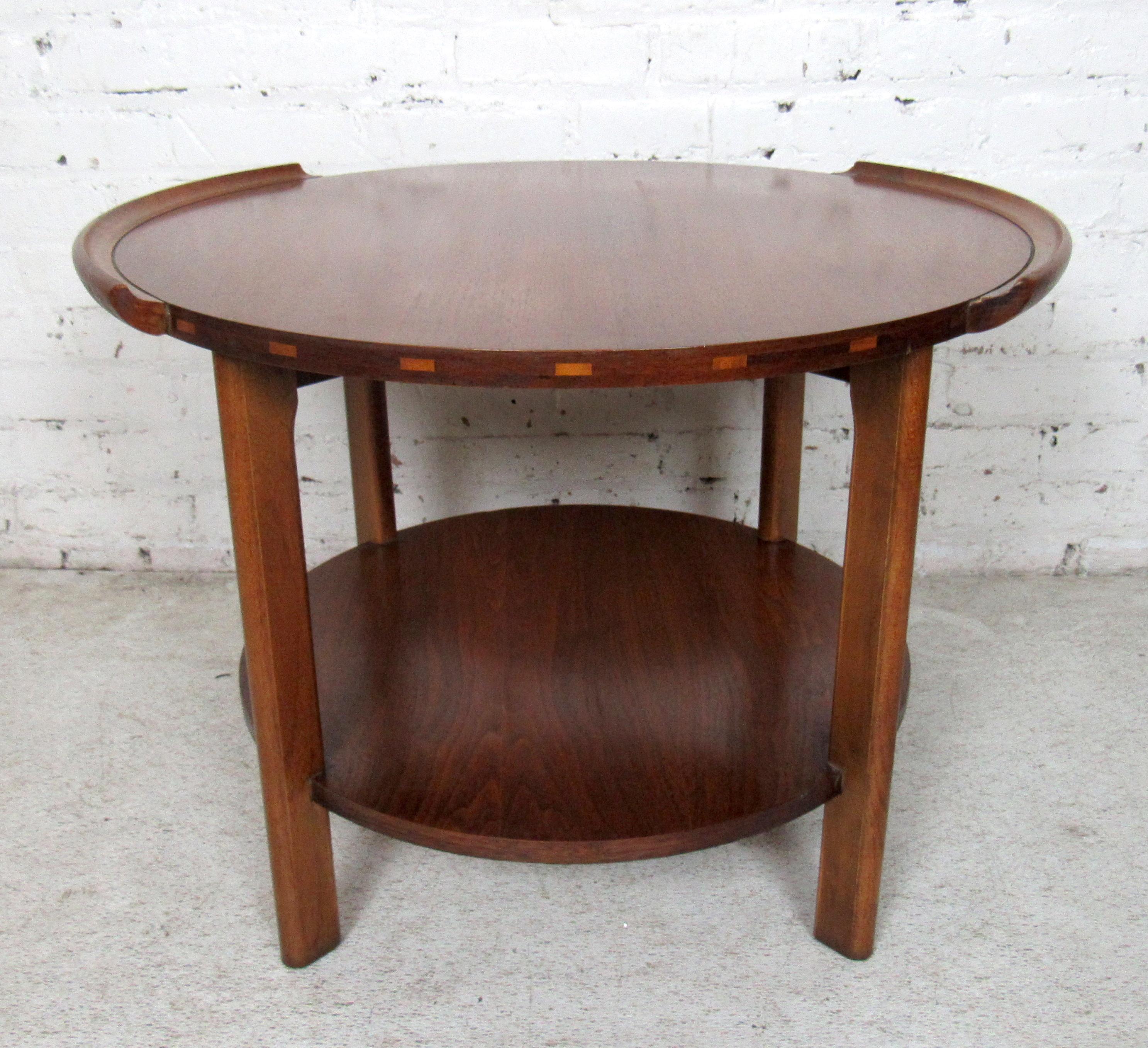 Mid-Century Modern round two-tier side table by Lane featured in rich walnut grain.

Please confirm item location with dealer (NJ or NY).
 
