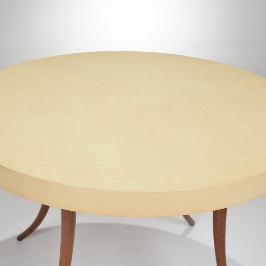 Vintage modern round table with a Formica top and teak base.
