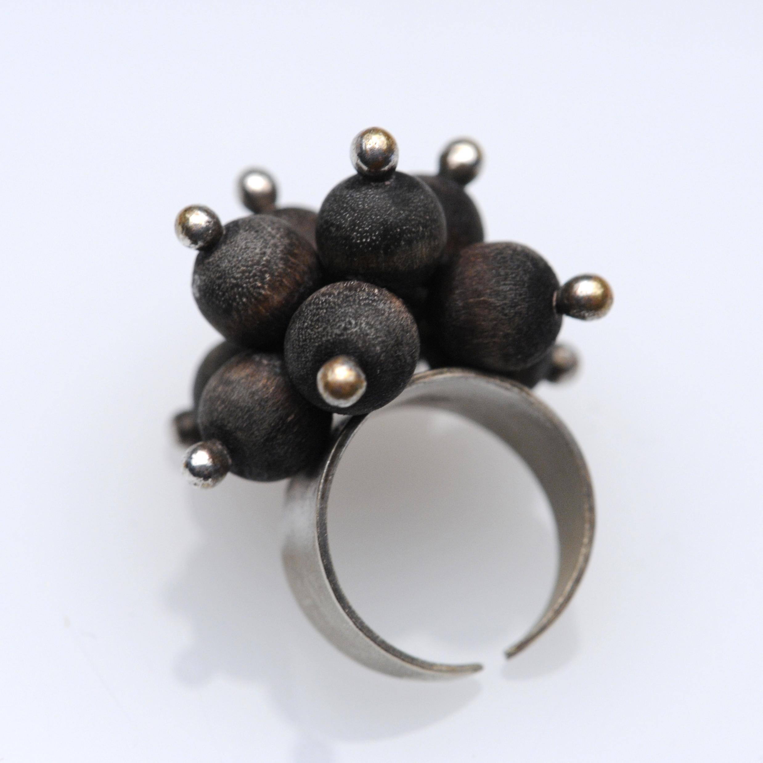 Beautiful and sculptural ring by Kaija Aarikka of Finland from the 1970s. Ring is made from silver and wood. Currently it is a size 6 but it is adjustable.