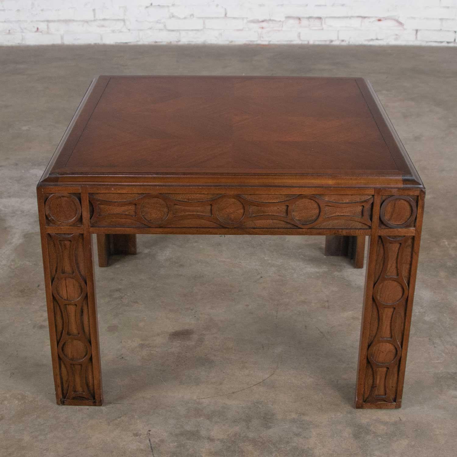 Handsome modern square Parsons style end table or side table by Lane with a carved circular leg design and chevron veneer top. It is in wonderful vintage condition. There are age appropriate signs of wear but nothing outstanding apart from a chip to