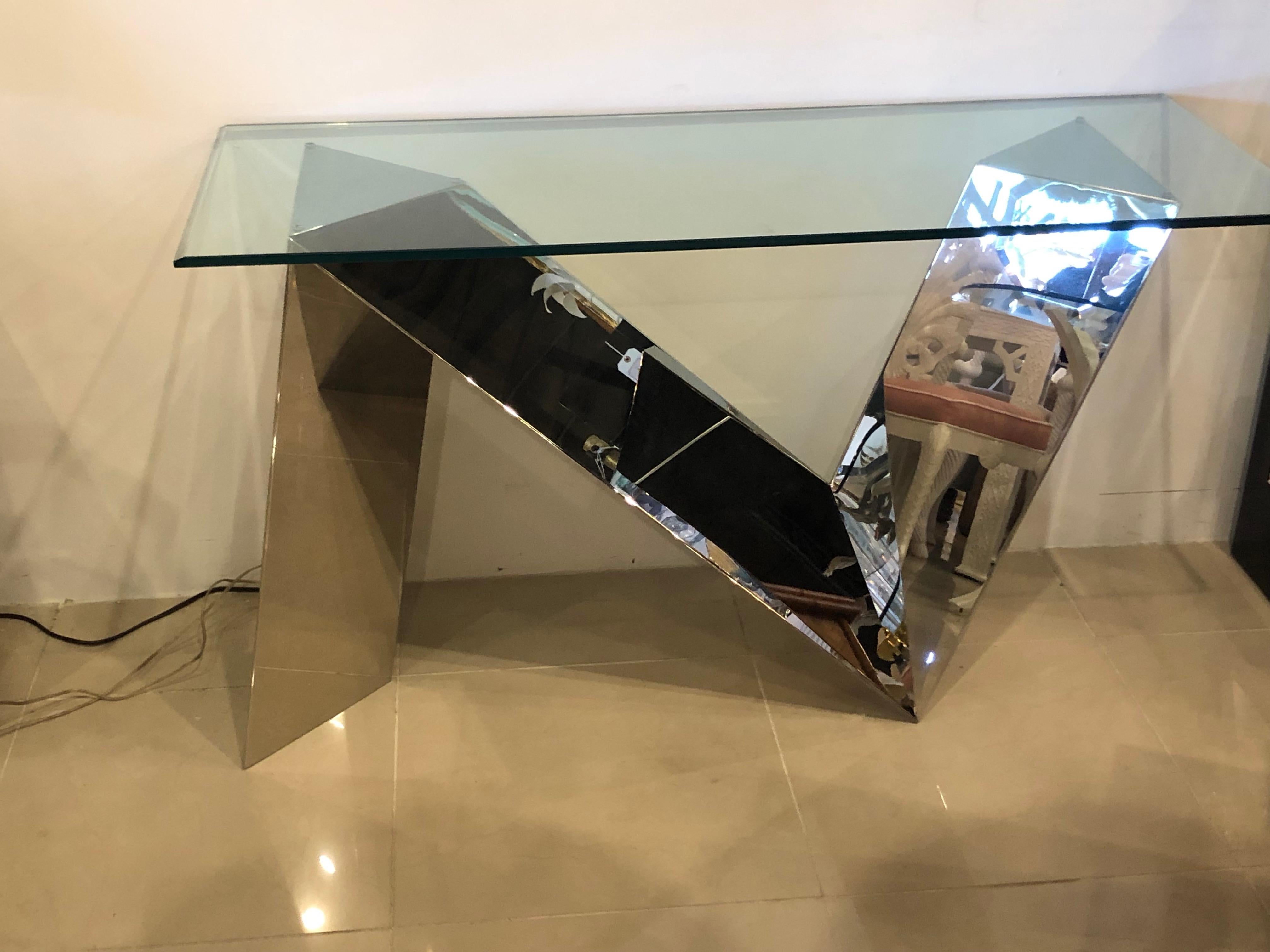 Amazing vintage stainless steel console table. This piece has been professionally polished. Glass top not included. Heavy and sturdy piece with a very zig zag geometric modern look.