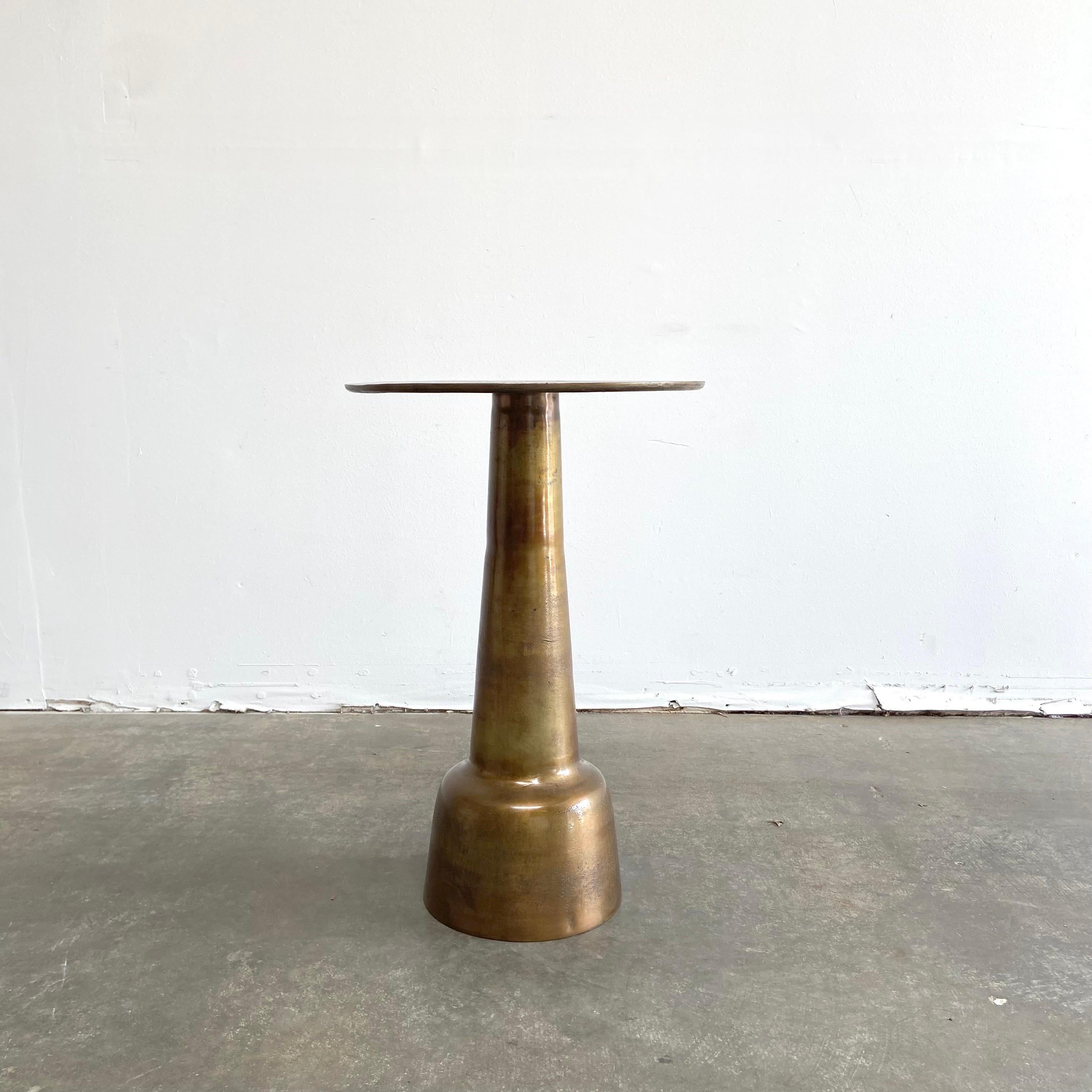 Antique brass finish side table.
Vintage modern style with beautiful patina. Perfect as a side table, or accent table in any room. Does have some weight to it, it is very sturdy.
Size: 19”RD. X 28-1/2”H.