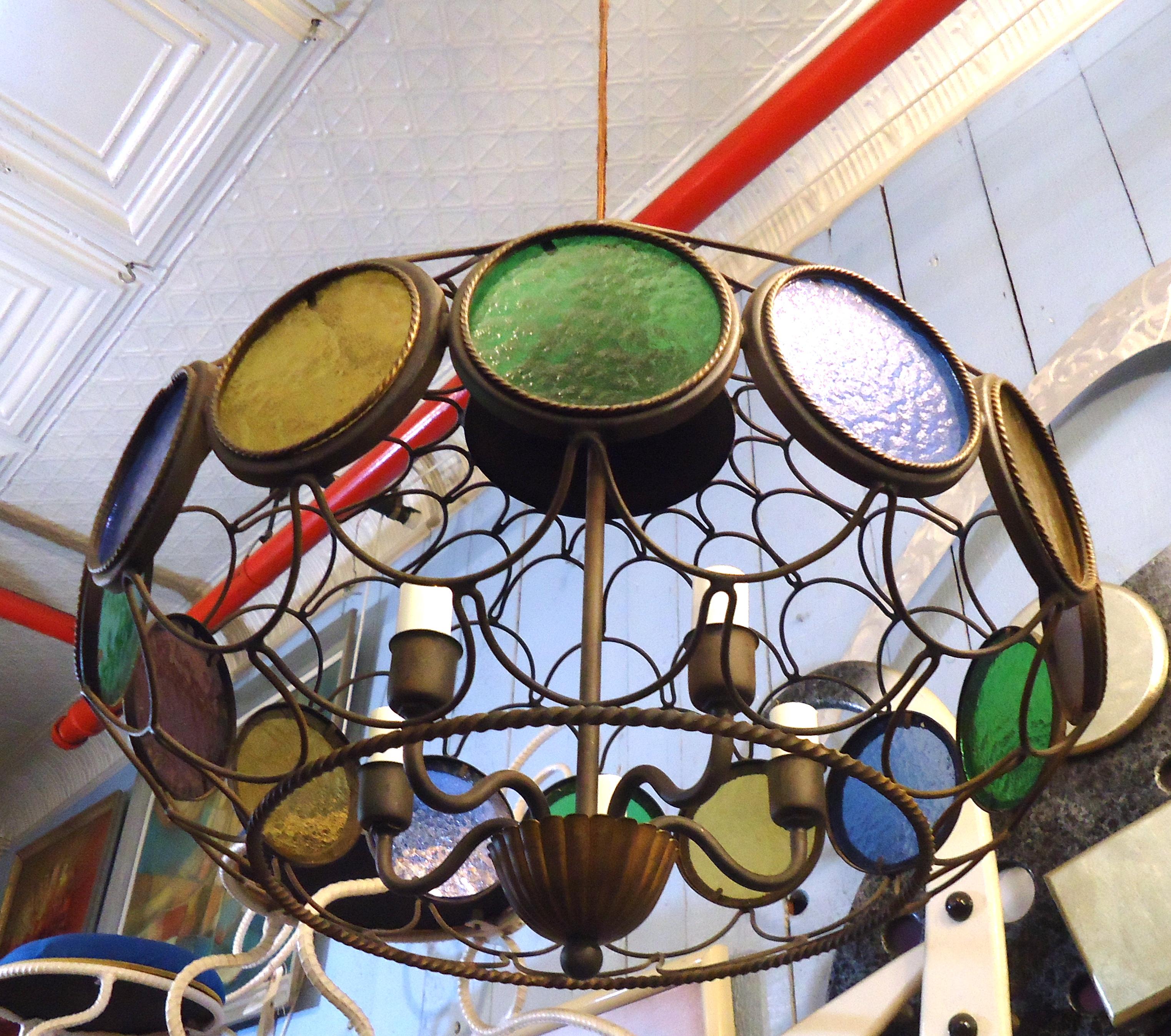 Mid-Century Modern Italian style chandelier features stained glass accents within a metal oval framed dome.
(Please confirm item location - NY or NJ - with dealer).