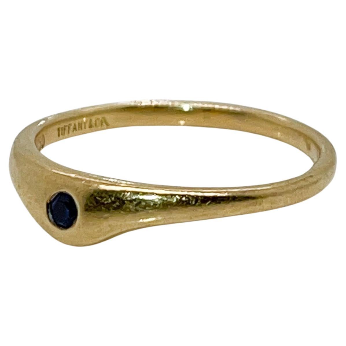 A fine modernist gold & sapphire ring.

By Tiffany & Co.

With a shaped shank and flush set with a round cut sapphire.

Simply great Tiffany design!

Date:
Late 20th Century

Overall Condition:
It is in overall good, as-pictured, used estate