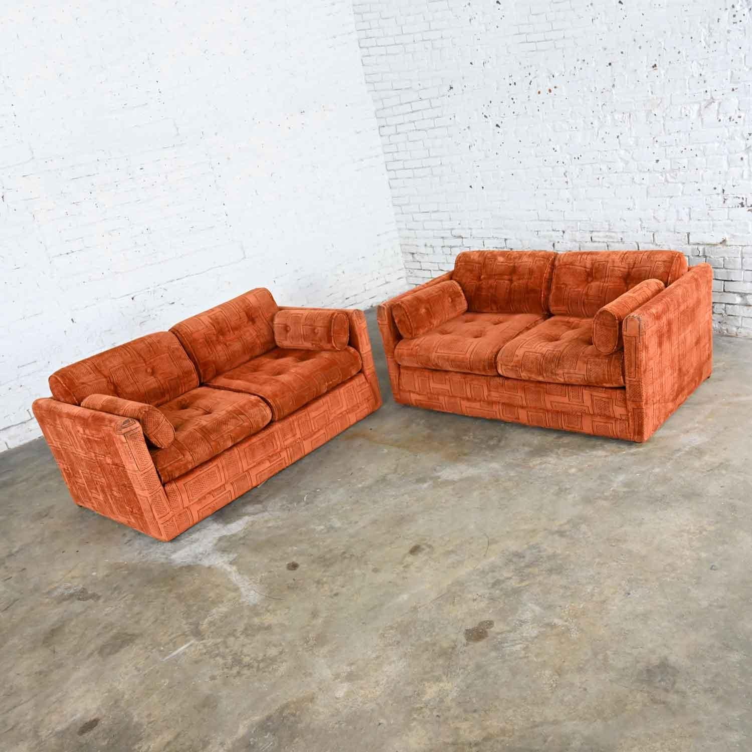 Handsome pair of modern tuxedo style rust color geometric textured chenille fabric upholstered love seats by Pem-Kay Furniture Co. Beautiful condition; but remember, these are vintage and not new so will have signs of use. The fabric has worn a bit