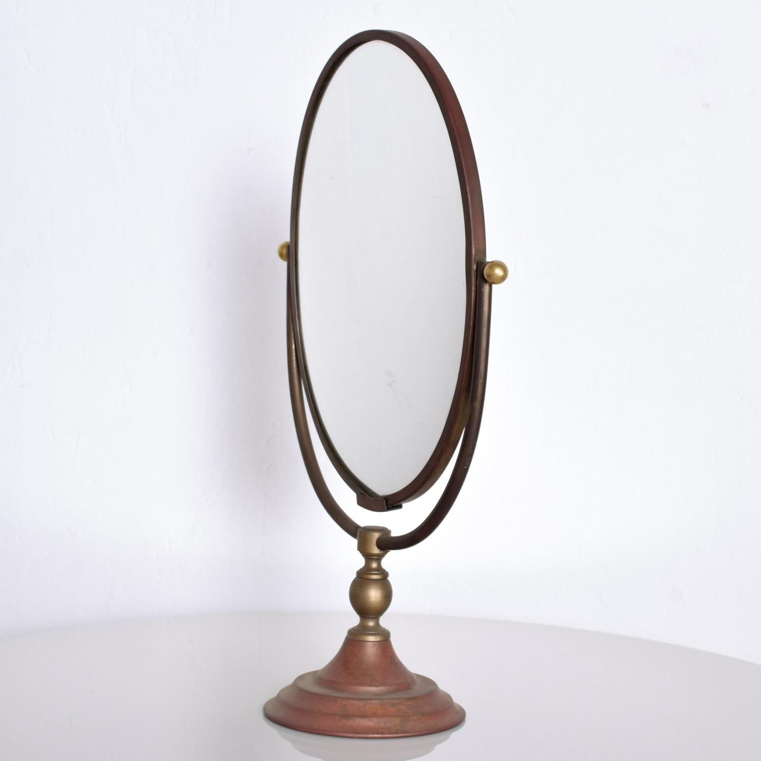 We are pleased to offer: an elegant Vintage Modern Vanity Standing Table Mirror After Gio Ponti, Italy. One-sided mirror with soft backside in an Oval Shape. Ref# MIRRGM12120202 Dimensions are: 15 1/4
