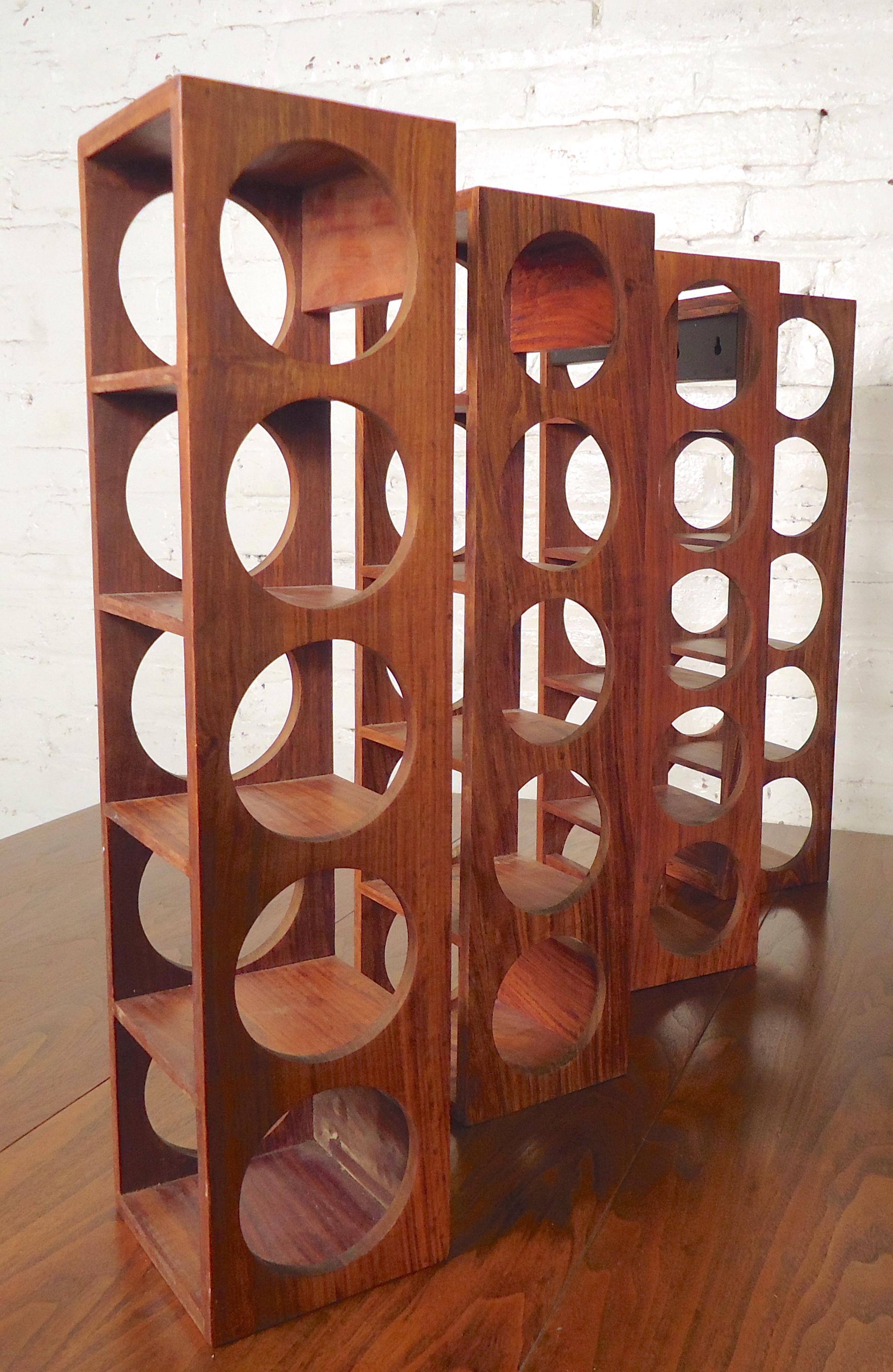 Mid-Century Modern wall hanging wine racks, holding five bottles each rack.
This set of wine racks are featured in rich teak wood grain.

(Please confirm item location NY or NJ with dealer).