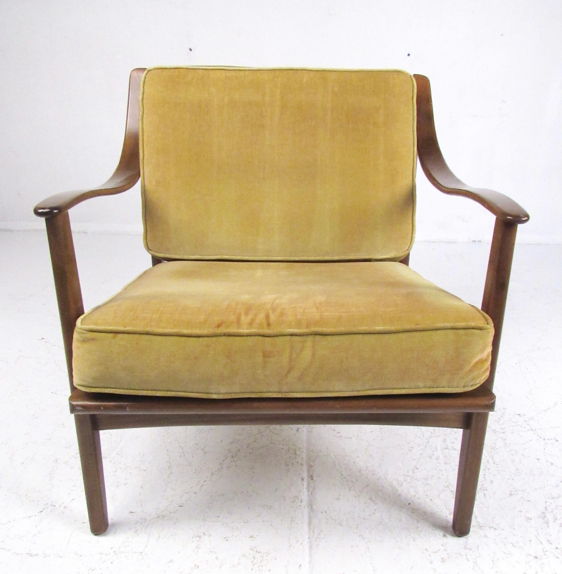 Vintage modern lounge chairs features sculptural walnut construction with vintage upholstered cushion. The impressive Mid-Century Modern design of the chair makes a comfortable seating addition to home or office arrangements. Please confirm item