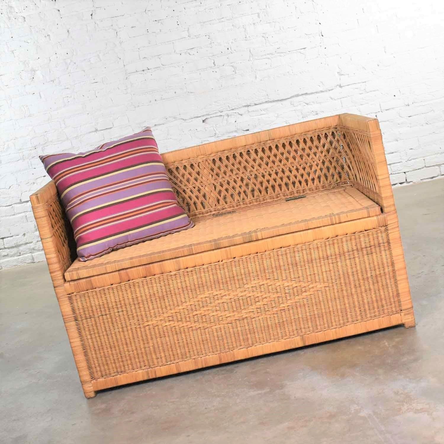Handsome modern wicker bench settee with trunk style storage in its seat. It is in fabulous vintage condition with no outstanding flaw we can find. Please see photos, circa 1970s-1980s. We have shown it with a pillow which we can include or
