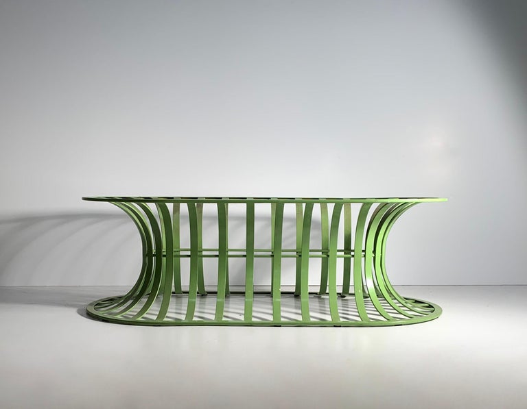 A Woodard aluminum frame in lime green. Can either be a coffee table with a added top, or a bench with added upholstery.