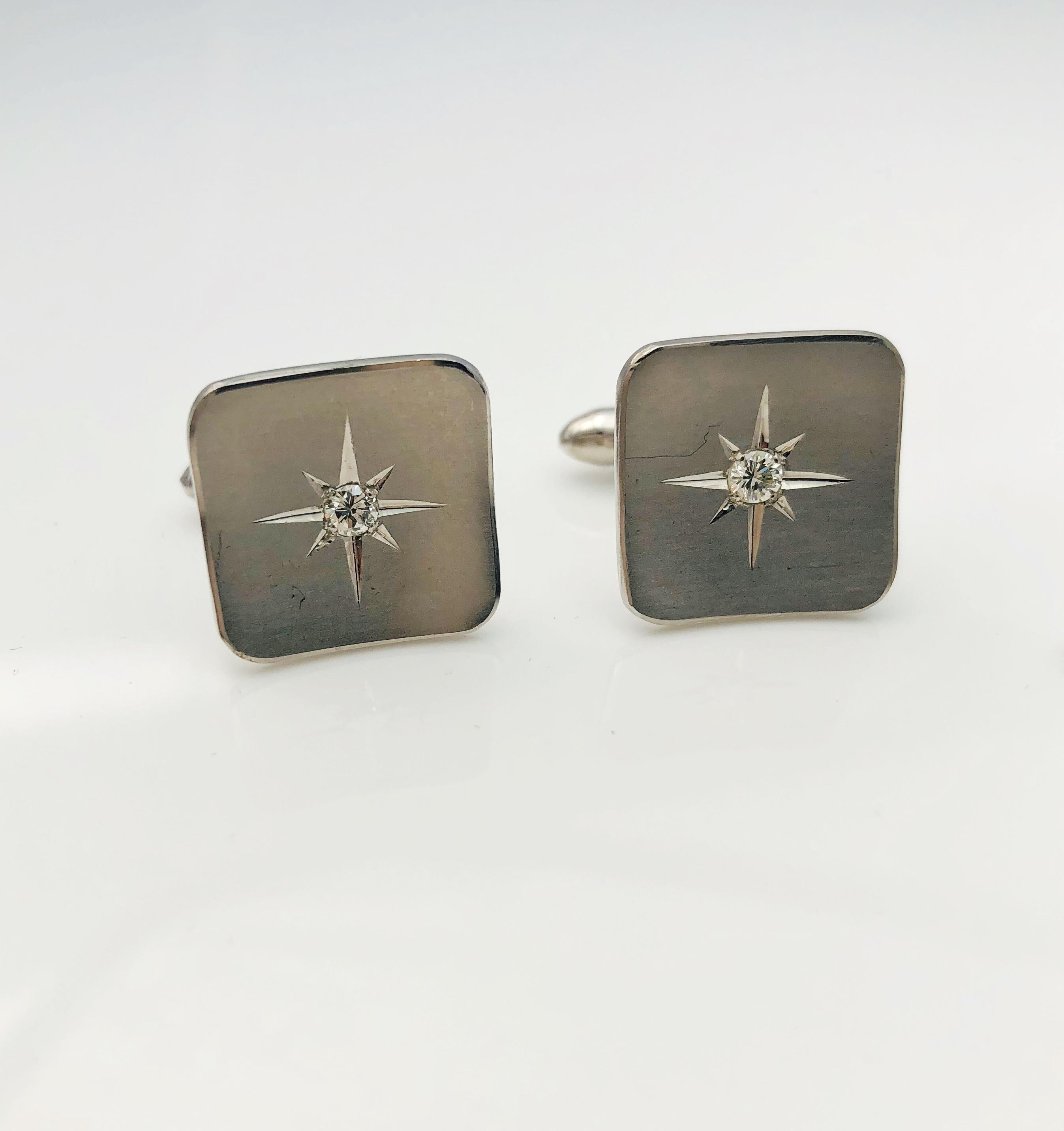 Absolutely Gorgeous Tuxedo Cufflinks and studs! This Vintage set is made in 14K White Gold. Each piece has a starburst symbol with a single diamond at the center. The cuffs each have a .10 carat round brilliant diamond and the studs each have a .06