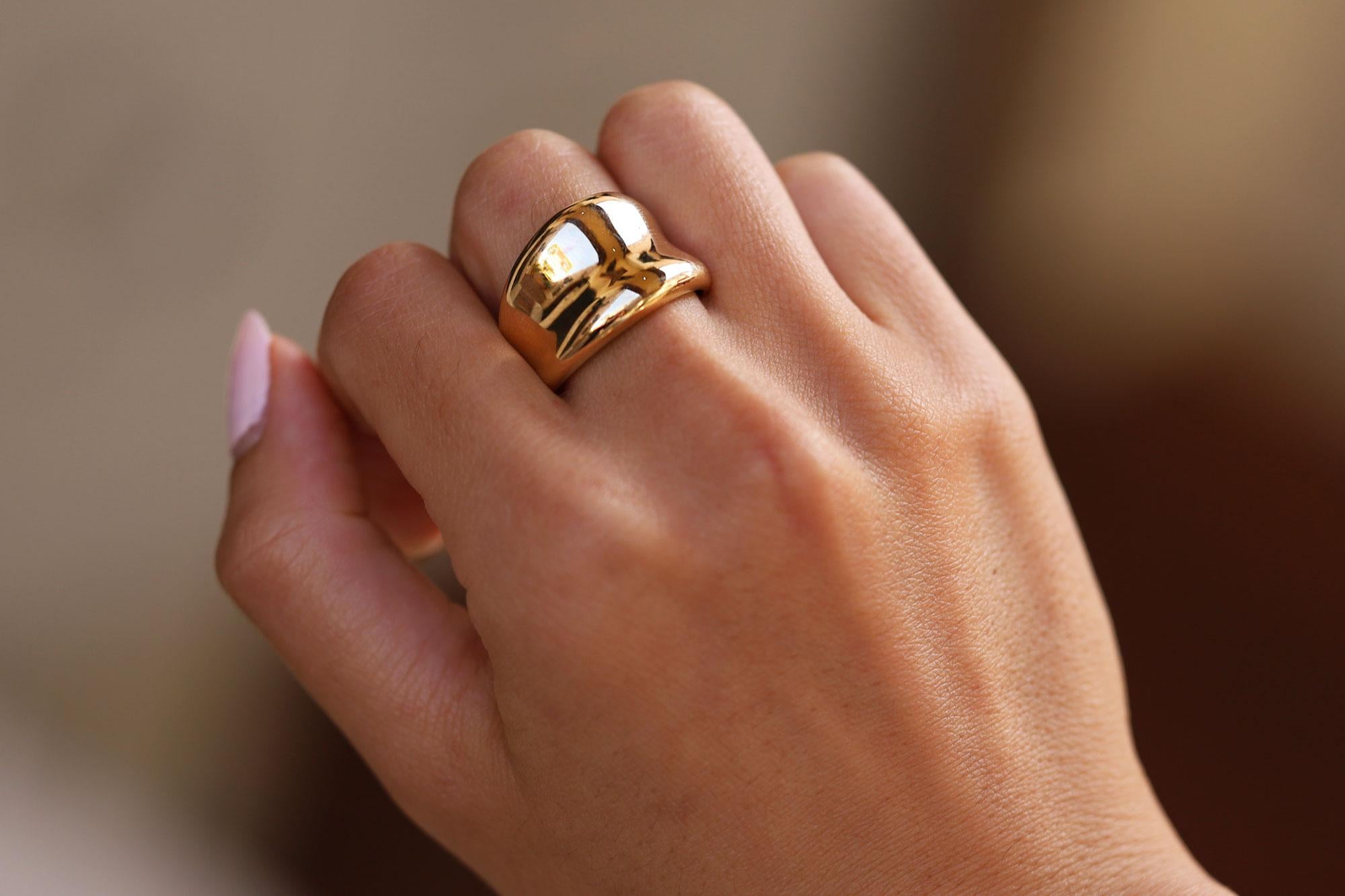 This vintage 14k gold cocktail ring offers a unique blend of contemporary style and classy luxury. Sustainably hand crafted of 14k yellow gold offering prominent finger coverage along with a unique, free-form design. Channel the current Mob Wife