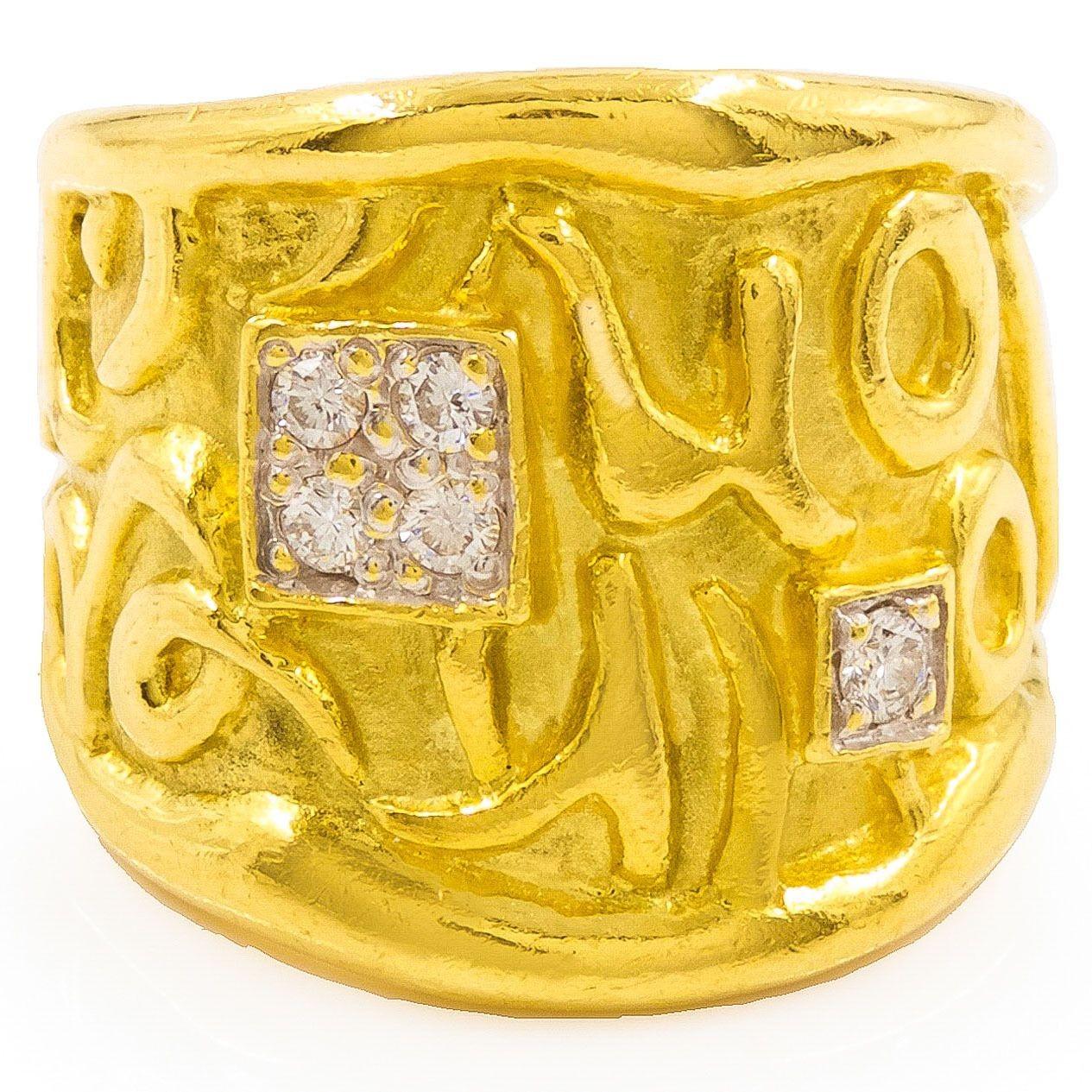 MODERNIST 18K YELLOW GOLD AND DIAMOND RING
With an embossed design set with 5 brilliant-cut round diamonds  Size 6/6.25
Item # 204KPI14L 

A very fun modernist ring with a bold embossed script surrounding two raised squares that frame a single