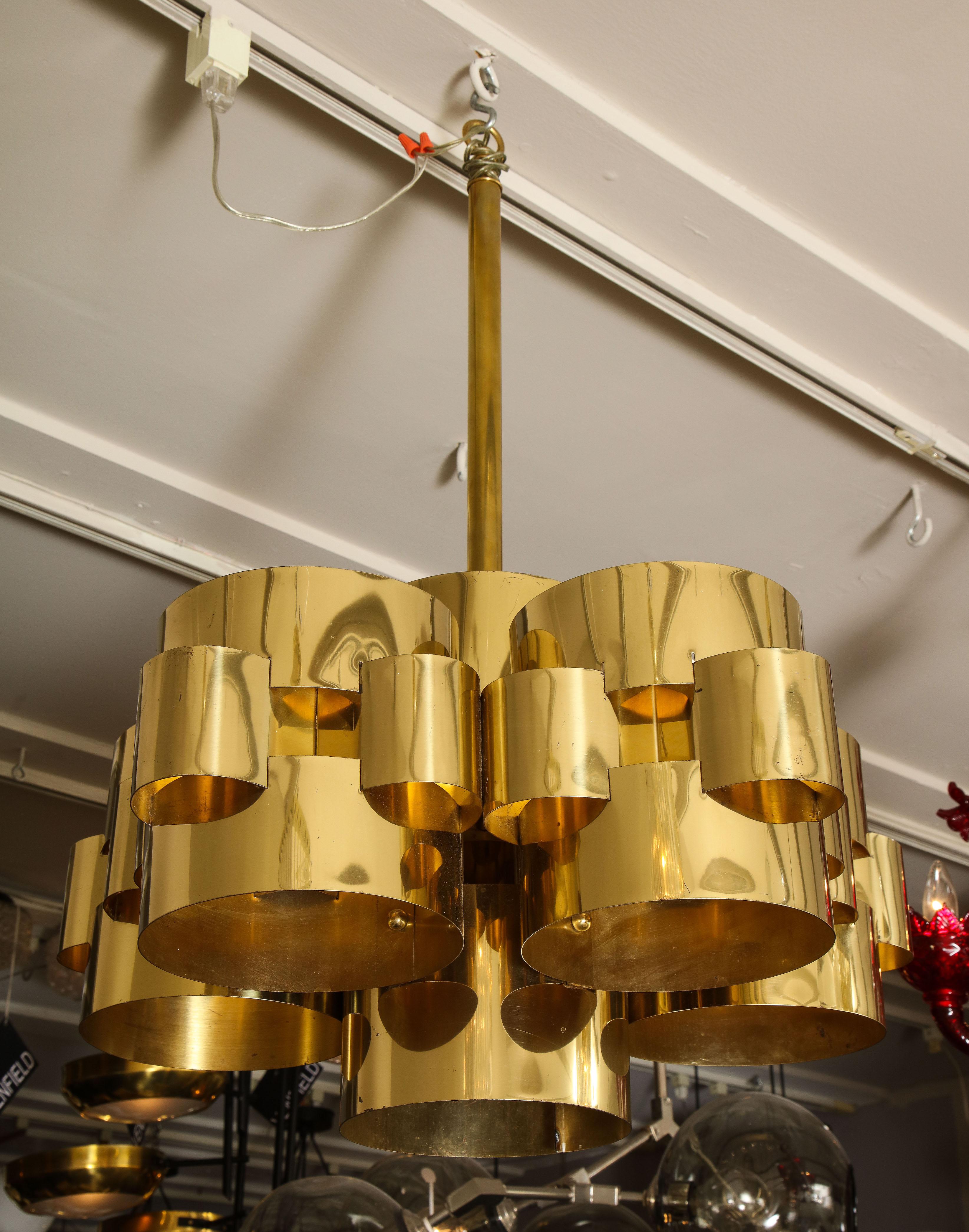 Vintage modernist Cloud chandelier in brass by Curtis Jere. The brass shades show some aging and fine scratches. It has 5 medium light sockets (E26).