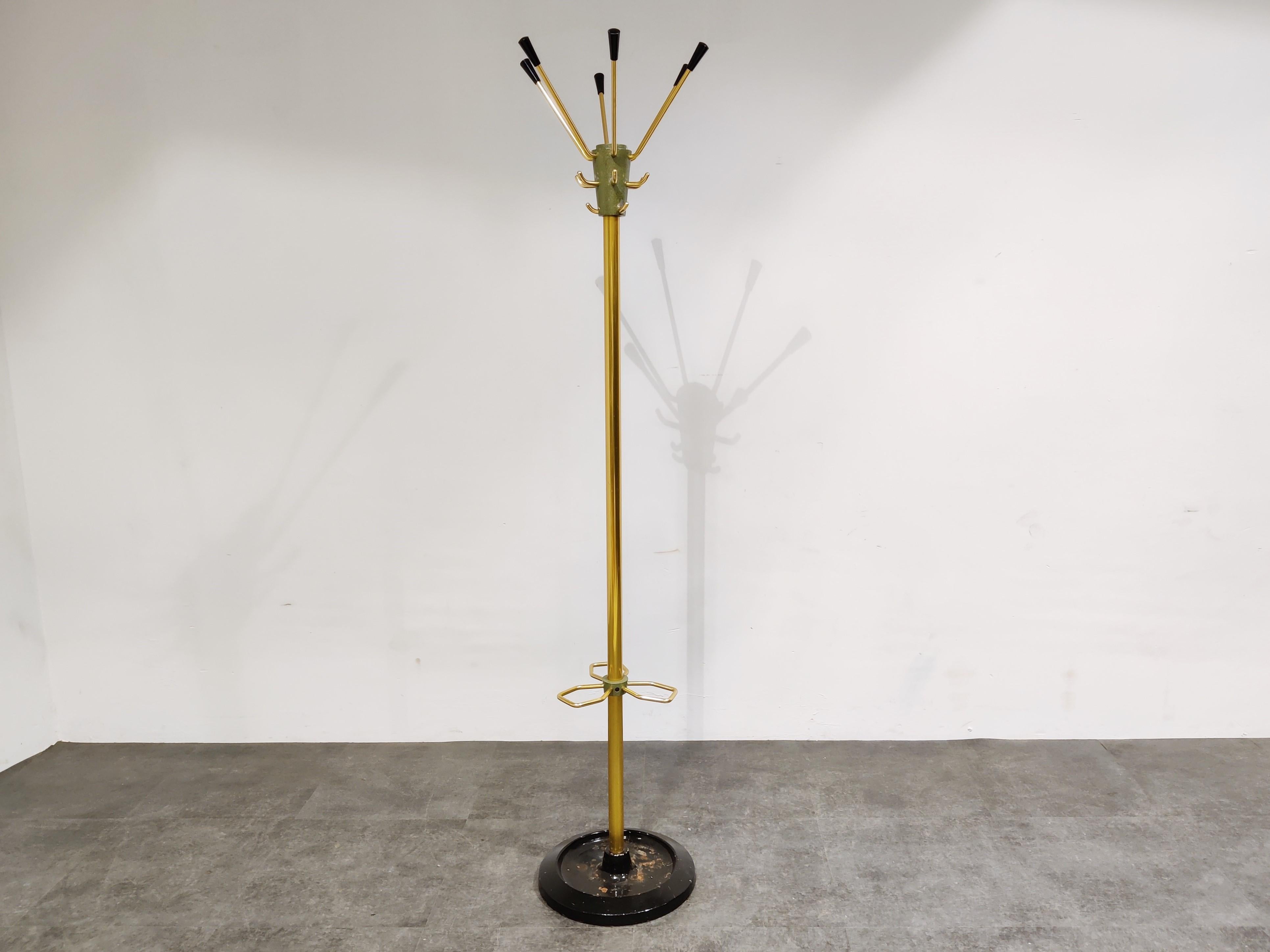 Mid century standing coat hook with umbrella holder designed by Jacques Adnet.

Gorgeous modernist design from the 1950s.

1950s - France

Good condition with minor wear.

Dimensions:
Height: 182cm/71.65