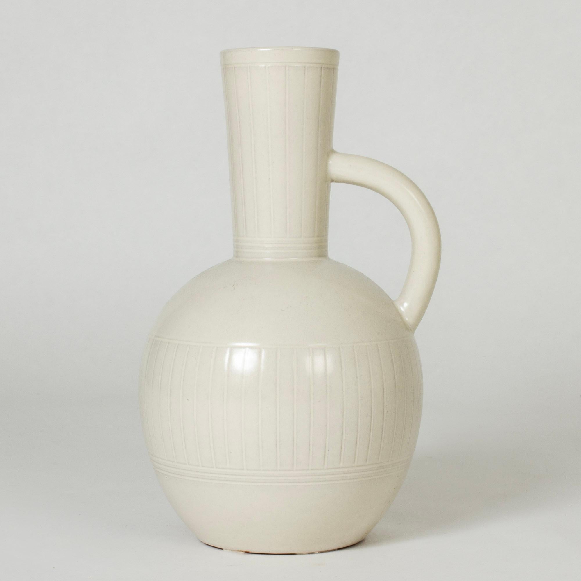 Large earthenware floor vase with a handle from Andersson & Johansson Höganäs. Generous, smooth form with eggshell white glaze.